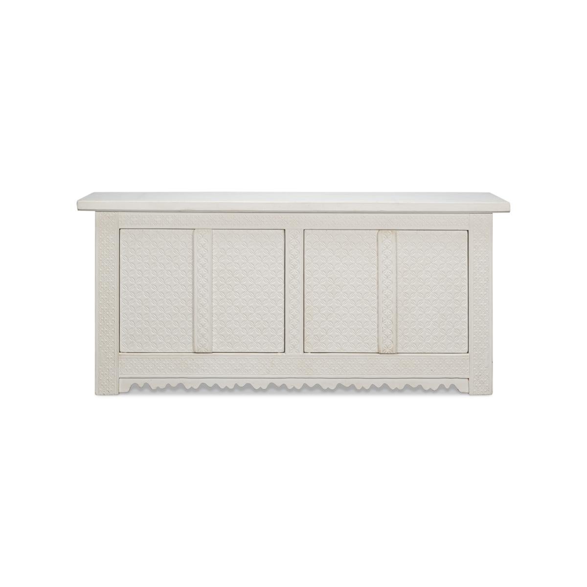 A dynamic piece of furniture suitable for use in a large hallway, in the den, or the dining room. With four doors that open to a painted interior with shelves and made with carved pine and a hand-rubbed antique white finish.

Dimensions: 79