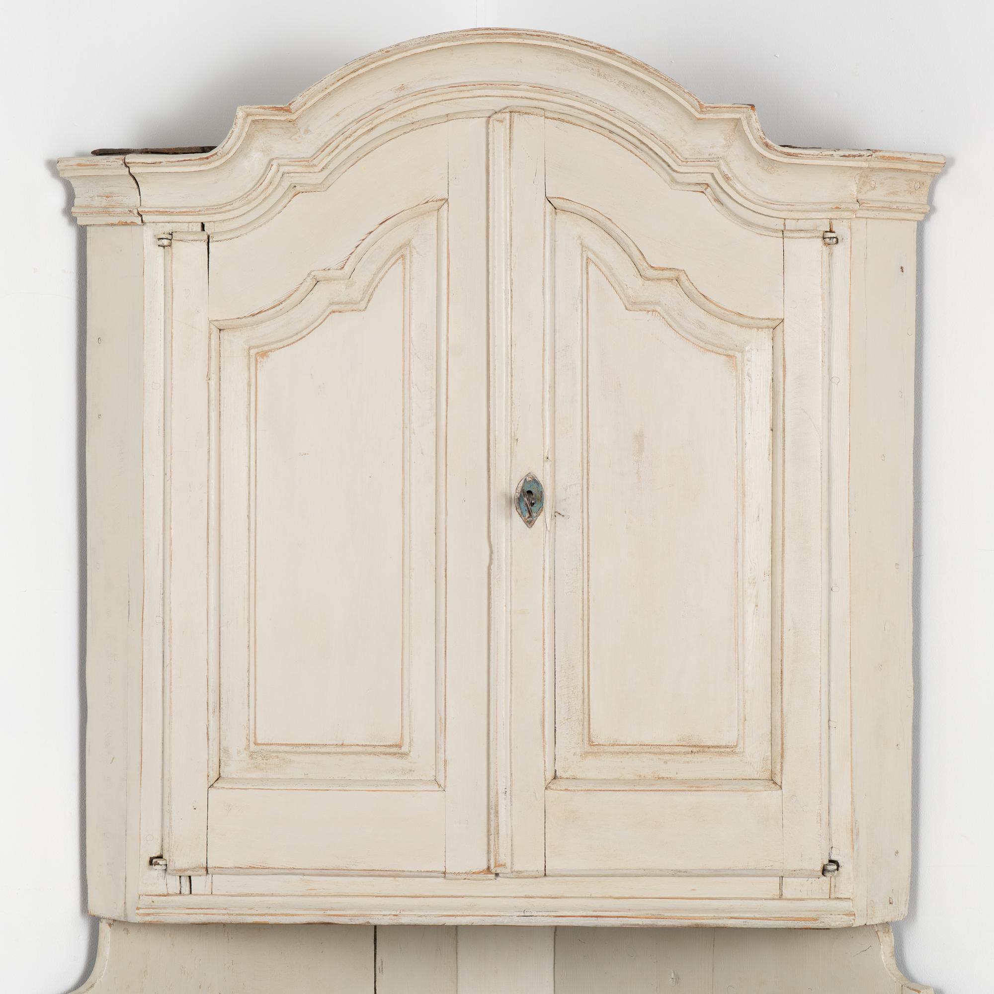 distressed white corner cabinet