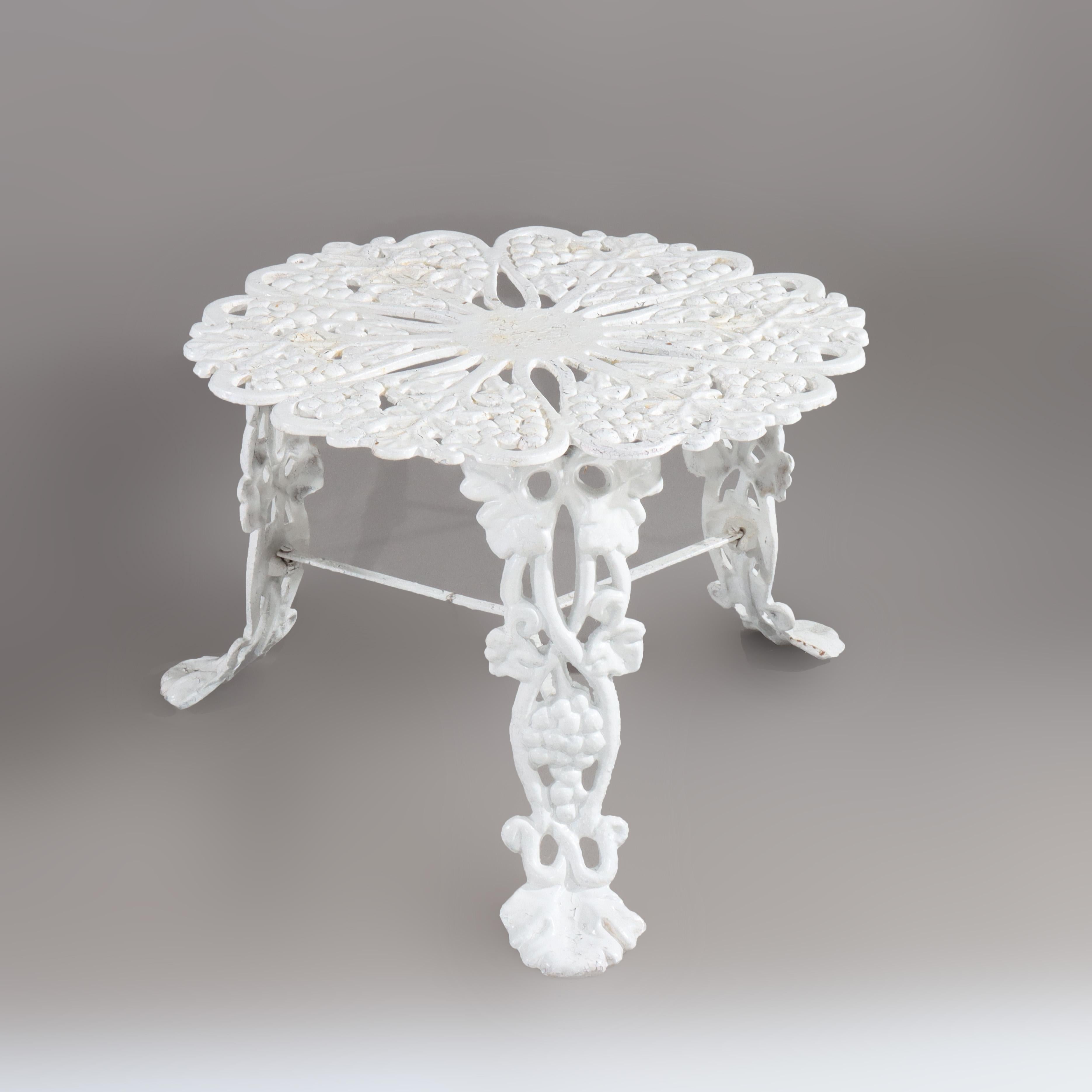 ***Reduced In-House Delivery Rates - Click on “Ask Seller” to Request a Quote***
Antique White Painted Wrought Iron Garden Side Table with Grape & Leaf Pattern C1890.    
Measures - 14 1/4