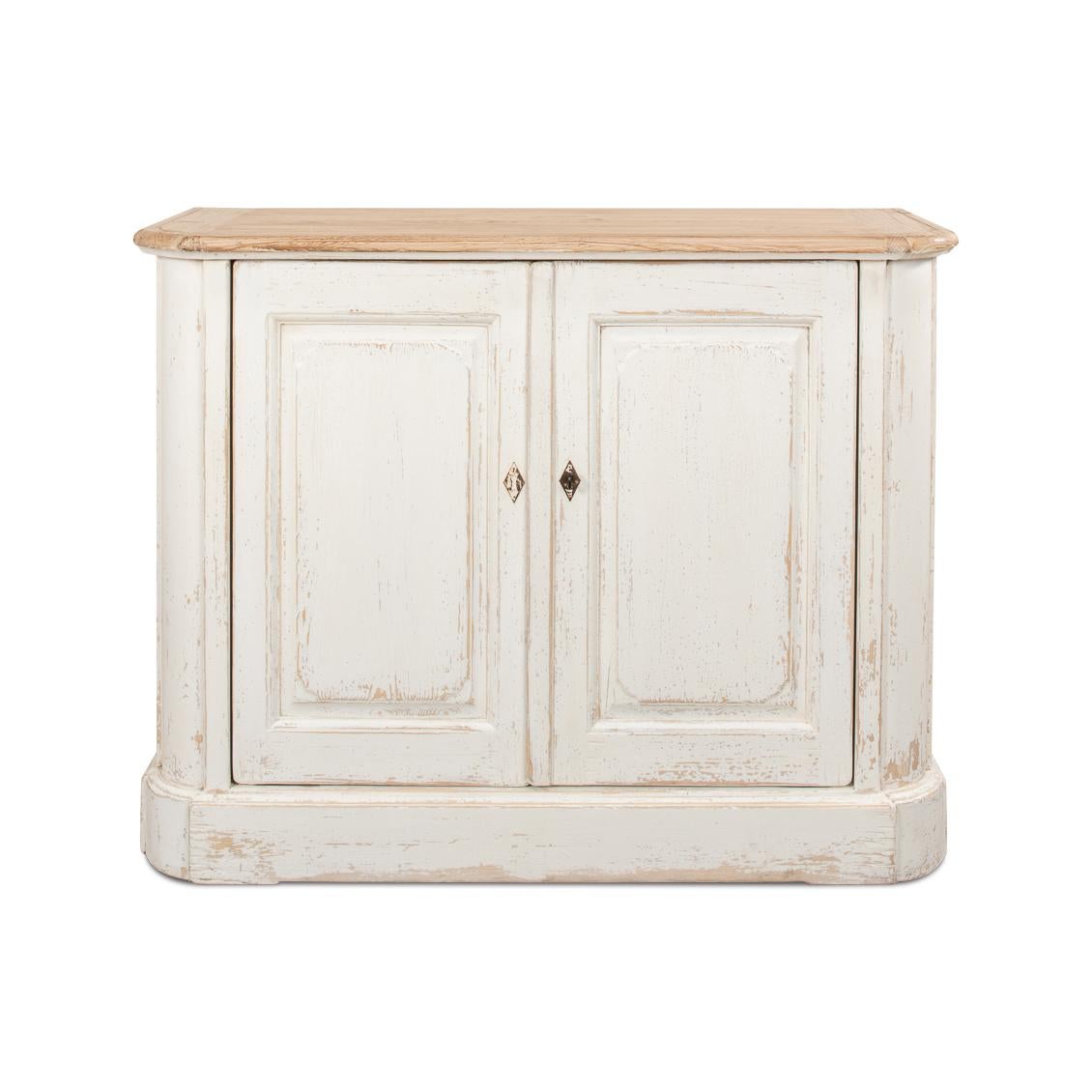 Reminiscent of a storied European past, this exquisite piece is crafted from reclaimed pine, it showcases a graceful antiqued whitewash-painted base and a natural finished wood top, lending it a serene country style with rustic elegance.

Perfectly