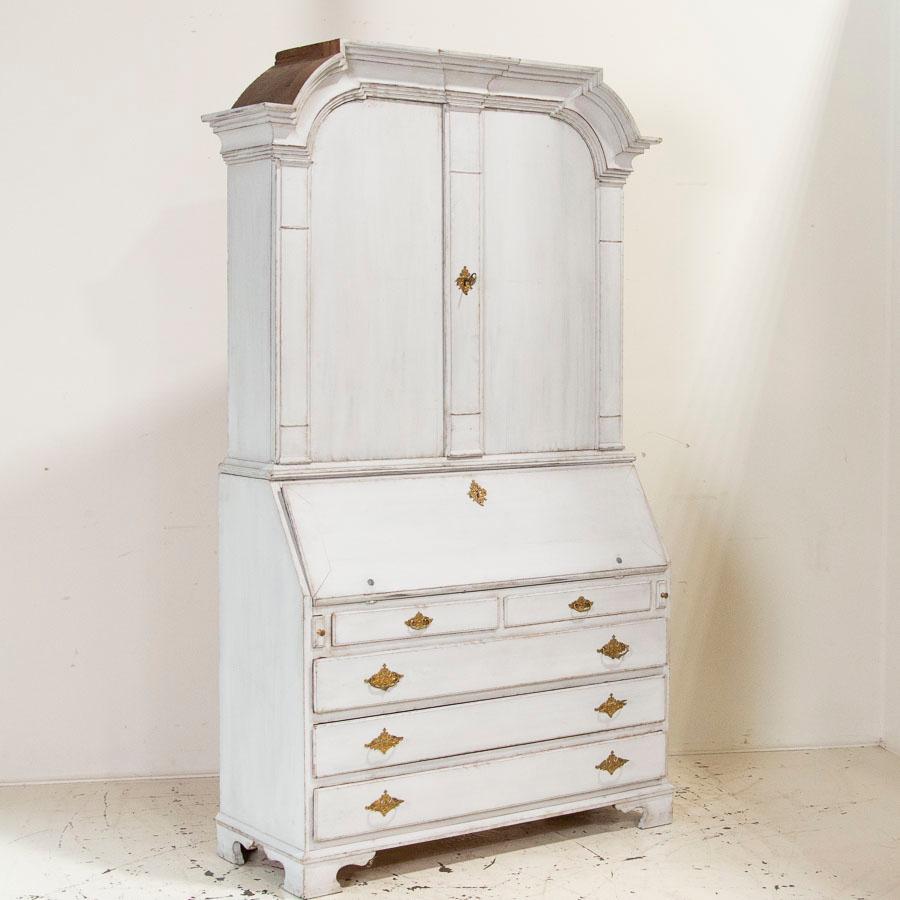 The simple yet stately lines add a touch of grace to this lovely tall secretary, also known as a 