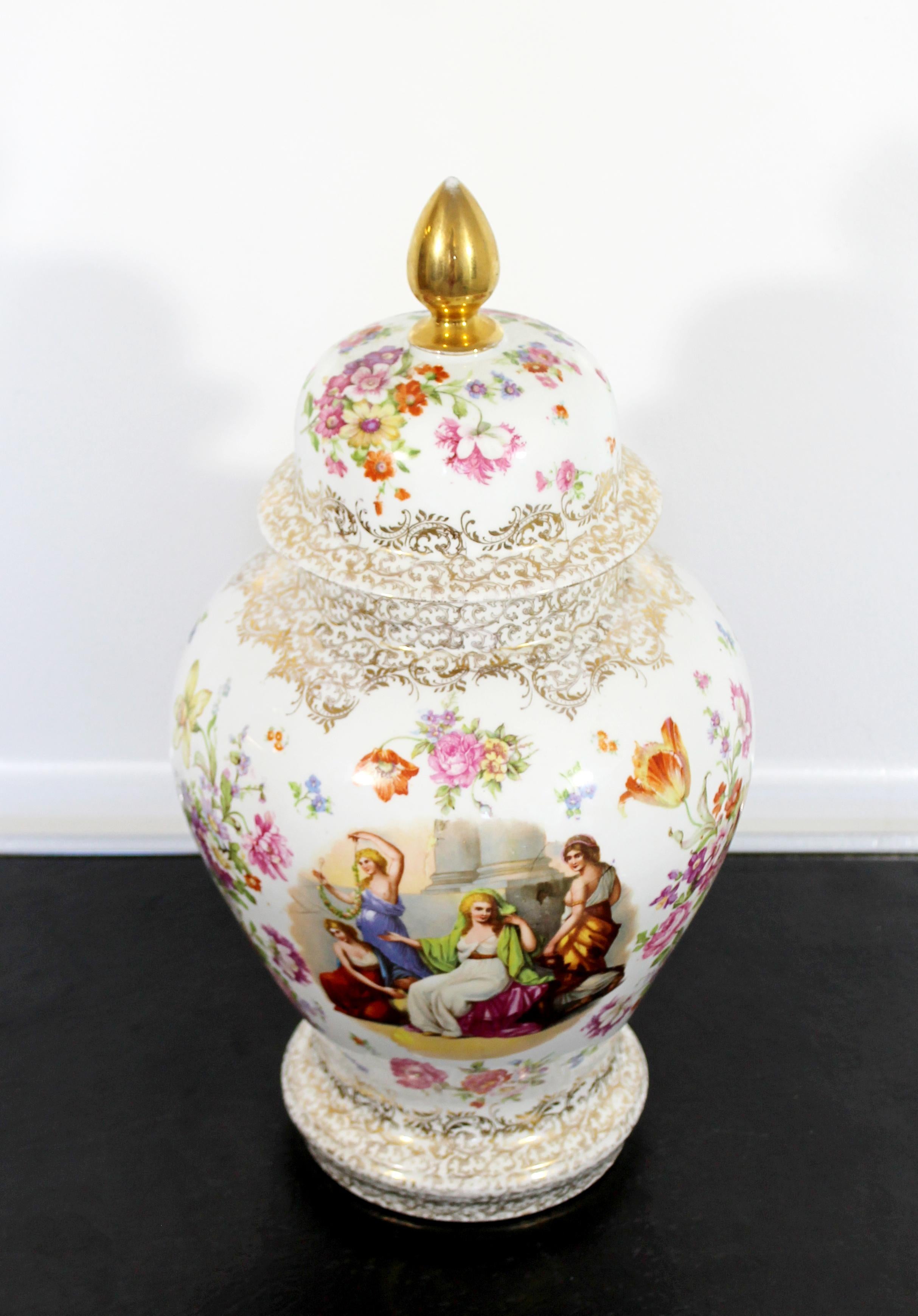 For your consideration is a captivating, white ceramic porcelain urn, with a lovely floral design and picture of women, stamped by Meissen. In excellent condition. The dimensions are 8