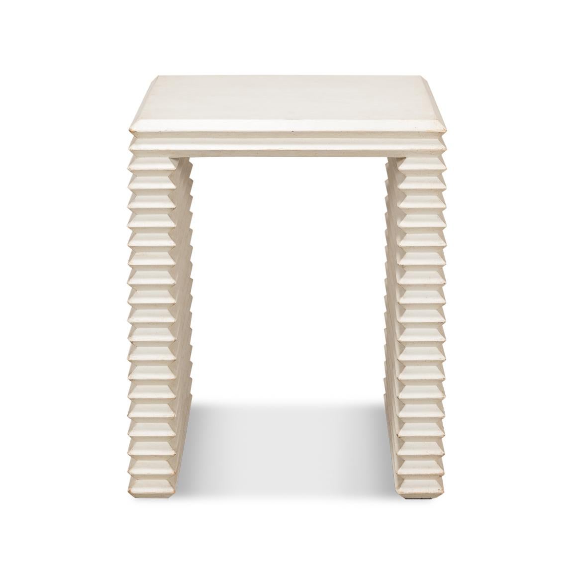 This unique piece brings a touch of artistic history into the heart of your living space.

The antique white finish on the wood softens the boldness of the form, making it a versatile addition to any room, whether it's standing solo or accompanied