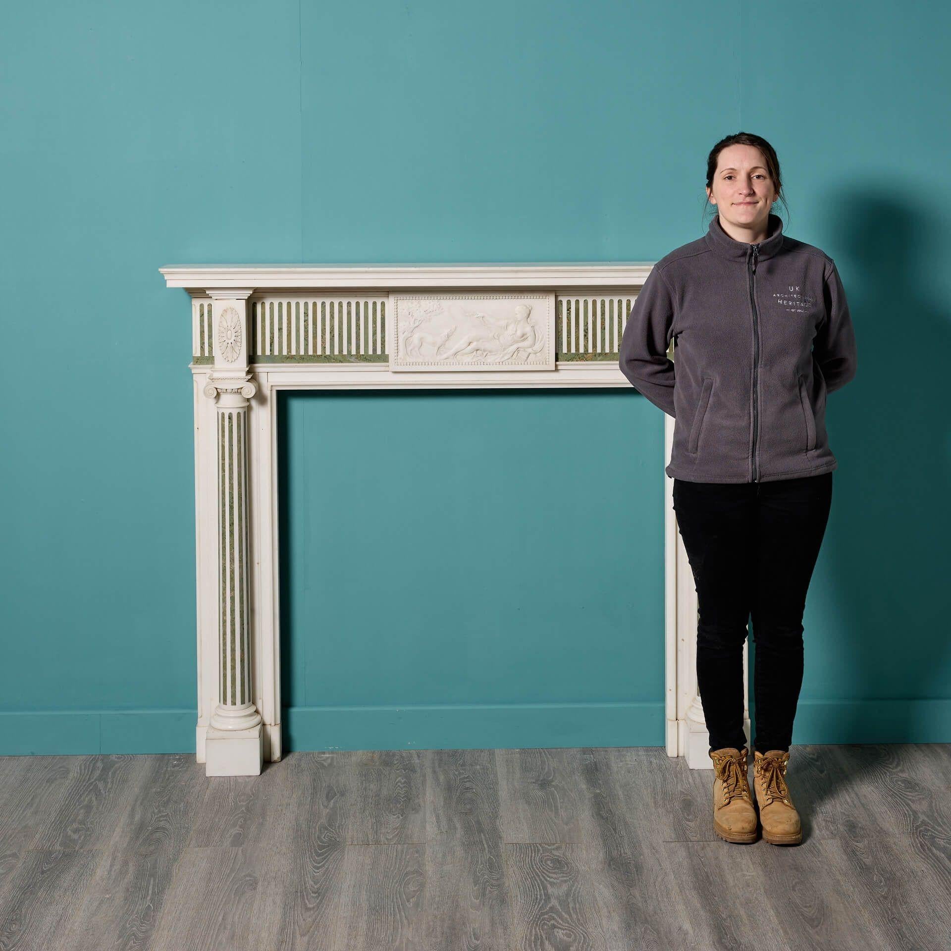 A stunning antique white statuary and green Connemara marble fireplace, circa 1880. Elegantly proportioned, this antique fireplace draws inspiration from classical Georgian styling, the statuary white marble boldly contrasted by vertical green