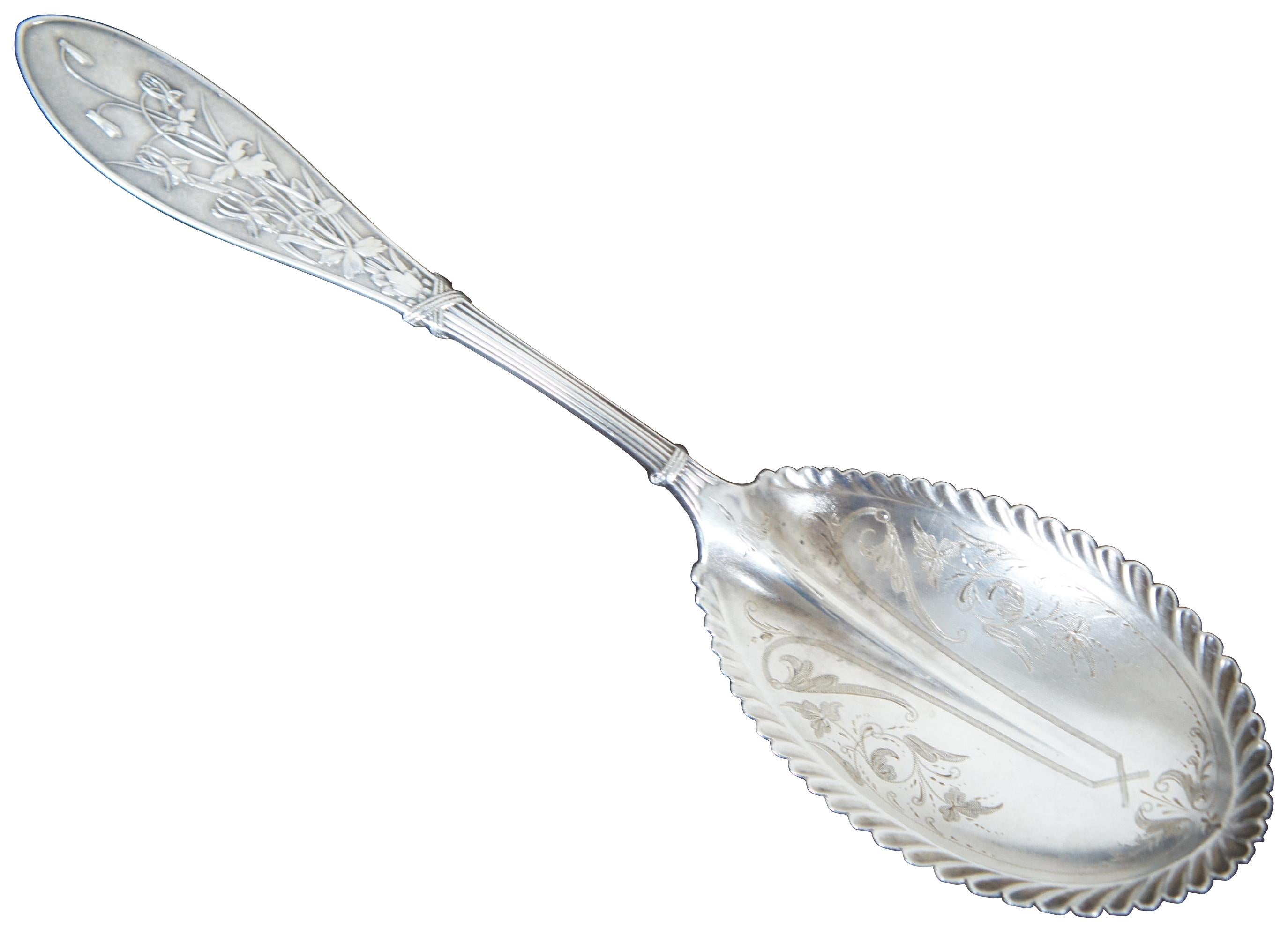 Antique W.W. Child Whiting Manufacturing Company sterling silver .925 casserole berry or citrus spoon in the 1870 Honeysuckle pattern with floral etched and scallop edged bowl; monogrammed “AAB.” Similar to the Arabeqsque pattern.
    