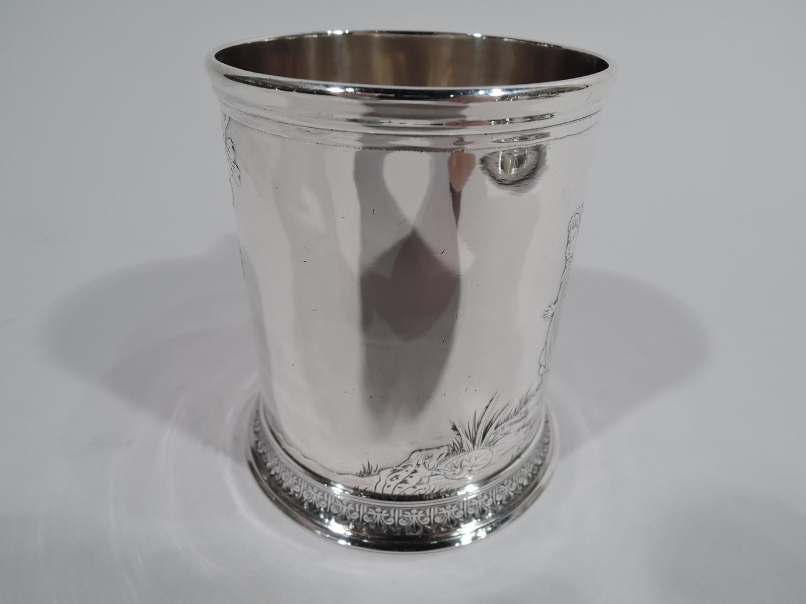 Turn-of-the-century Edwardian Art Nouveau sterling silver baby cup. Made by Whiting in New York. Straight sides with molded rim and c-scroll handle. Foot skirted with low-relief leaf-and-dart border. On front acid-etched figural scene with bonneted
