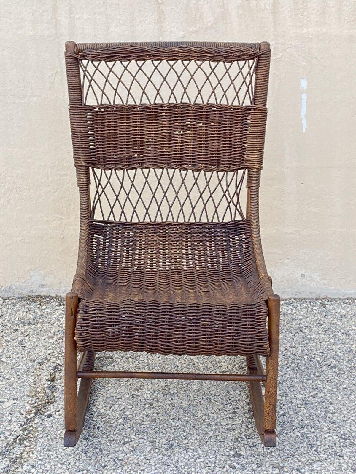 Antique Wicker and Rattan Wooden Victorian Rocking Chair Rocker. Item features a solid wood wicker wrapped frame, very nice antique, quality American craftsmanship, great style and form. Circa 19th Century. Measurements: 34