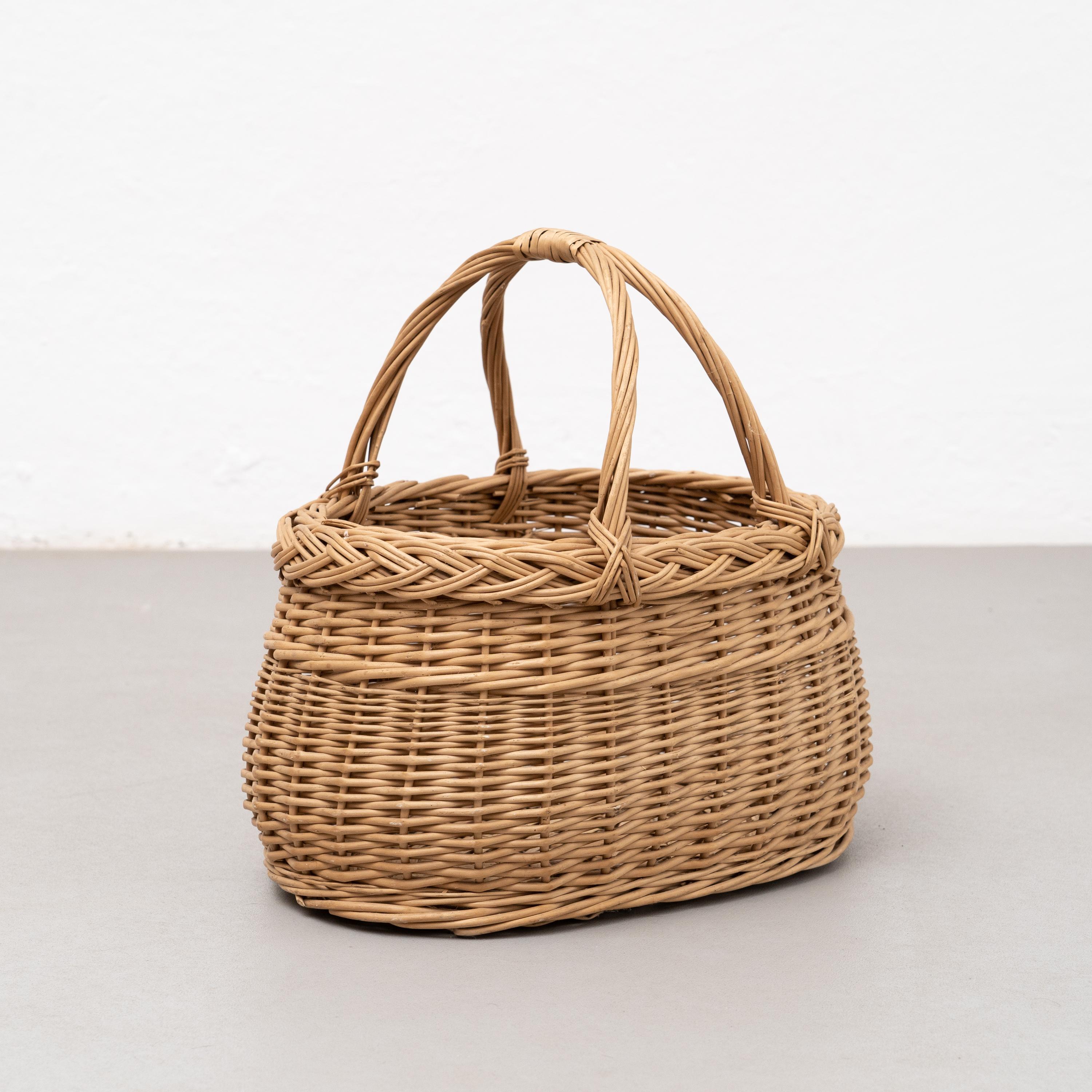 Antique wicker basket.

By unknown artist, circa 1970.

In original condition, with some visible signs of previous use and age, preserving a beautiful patina.

Materials:
Wicker.
 