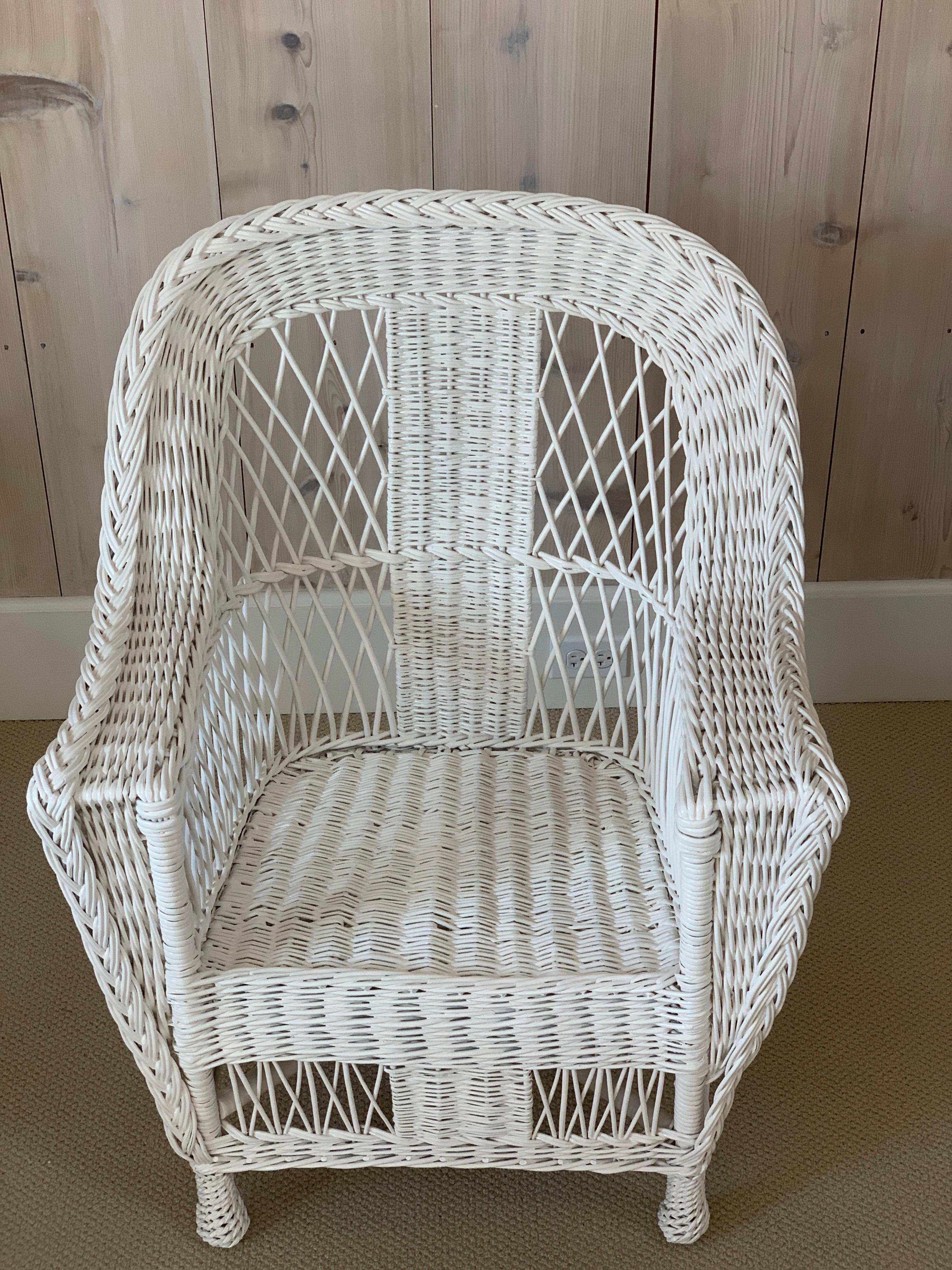 Antique willow wicker chair in fresh white paint. Handwoven of willow this chair measures: 28' wide, 26