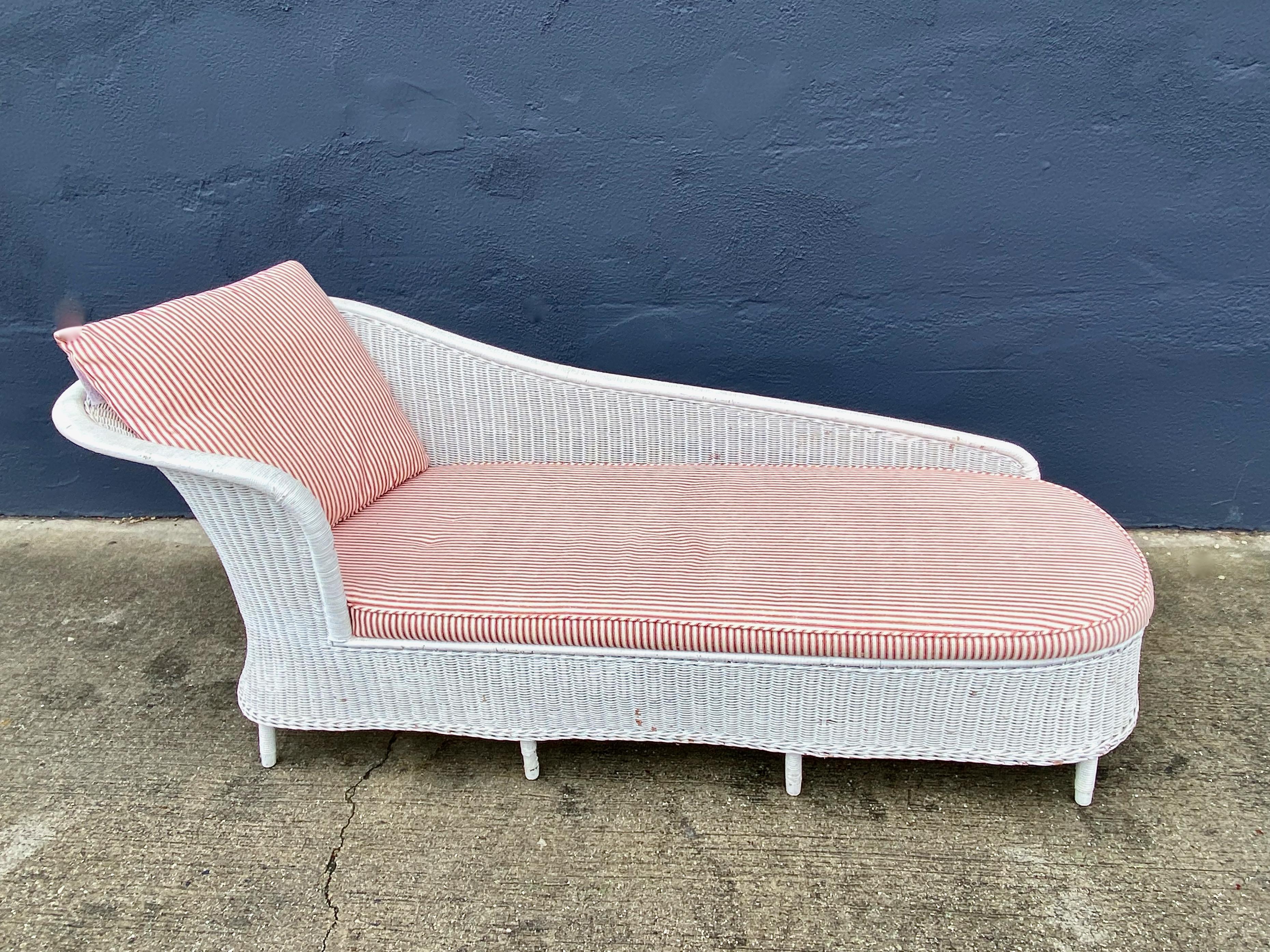 It is quite unusual to find an early 20th century wicker chaise longue in the nearly pristine as this one was found--fresh from a Beverly Hills Estate. This chaise embodies the current Coastal Design aesthetic. There is some minor rubbing to the