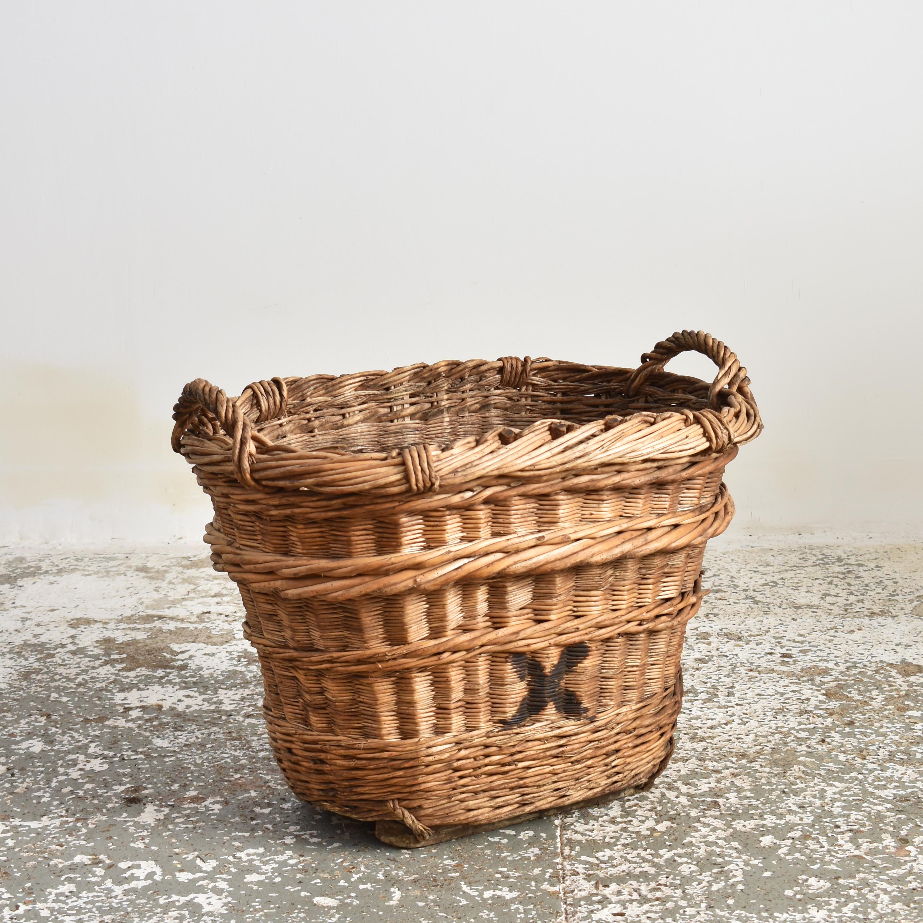 Antique Champagne Harvest Basket – X

A beautiful hand-made wicker champagne basket from France used to harvest grapes in the champagne region. The markings identify the grower and vineyard it belonged to. The basket has reinforced sides with