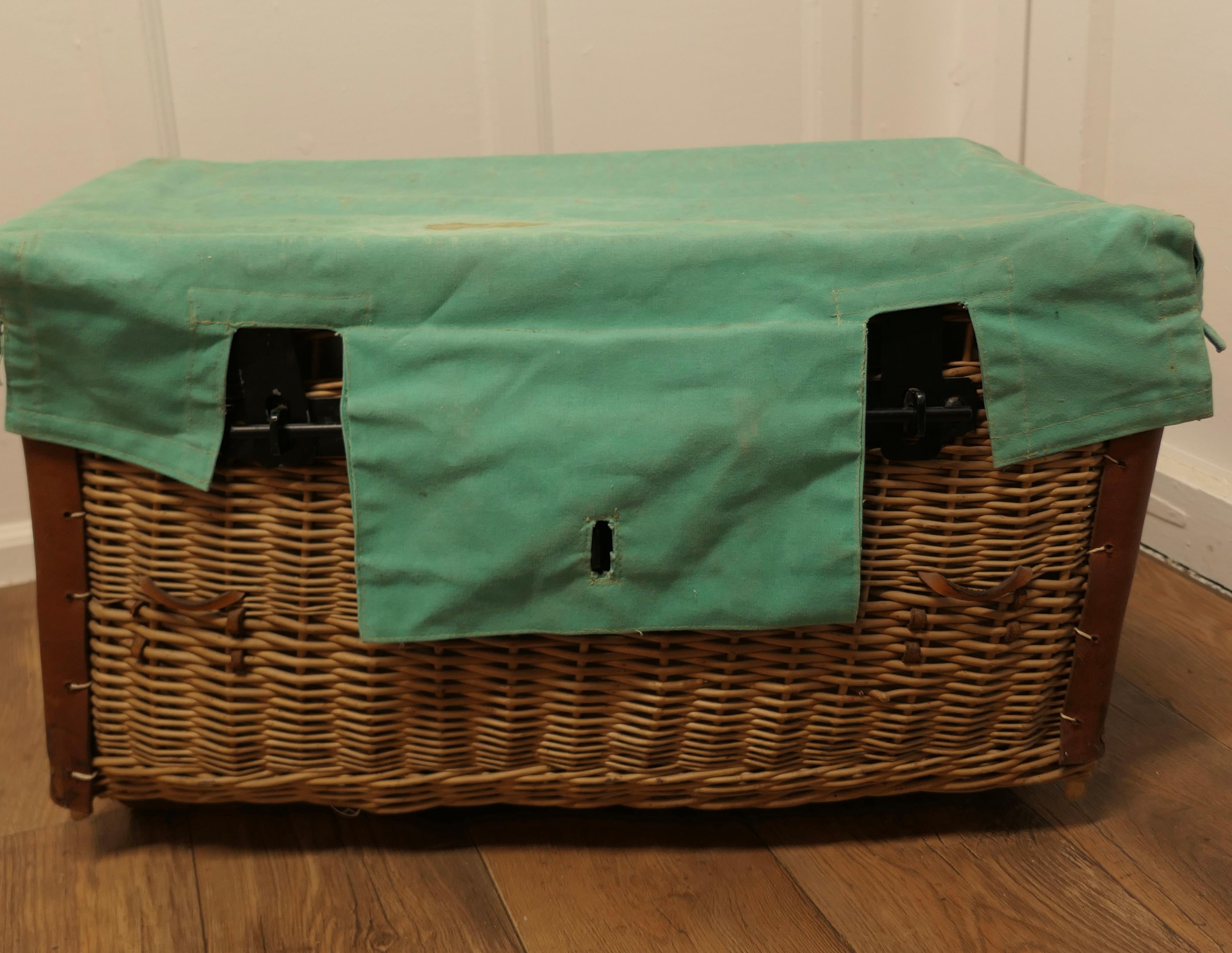 Antique Wicker Laundry Basket or Linen Hamper

This is an excellent example and in remarkably good condition for its age, the basket originates from a military source, it has a canvas lining, and a green canvas cover which is attached along the back