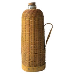 Jarra termo antigua de mimbre y vidrio de mercurio