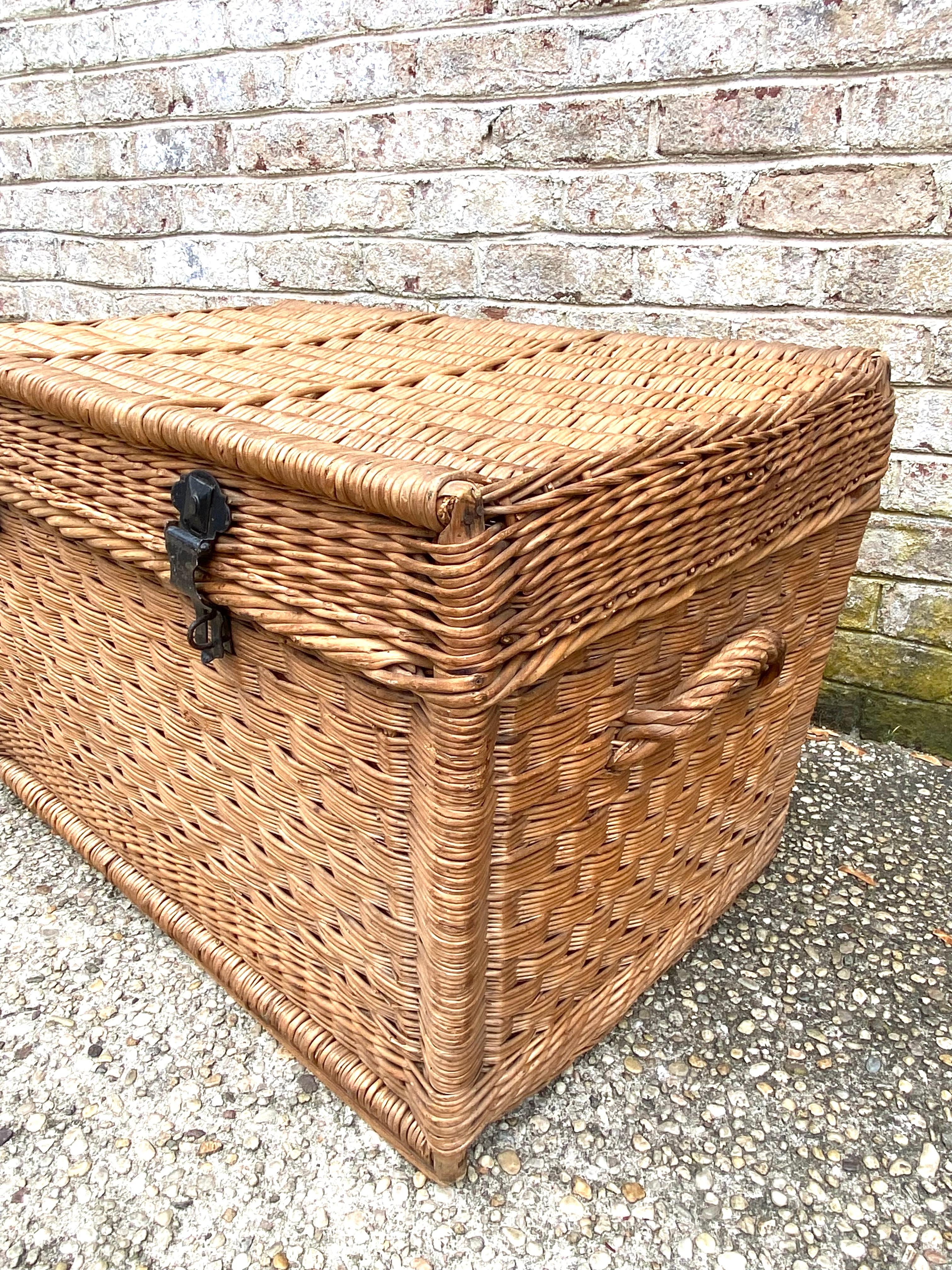 Handsome wicker trunk or blanket chest with original iron hardware.