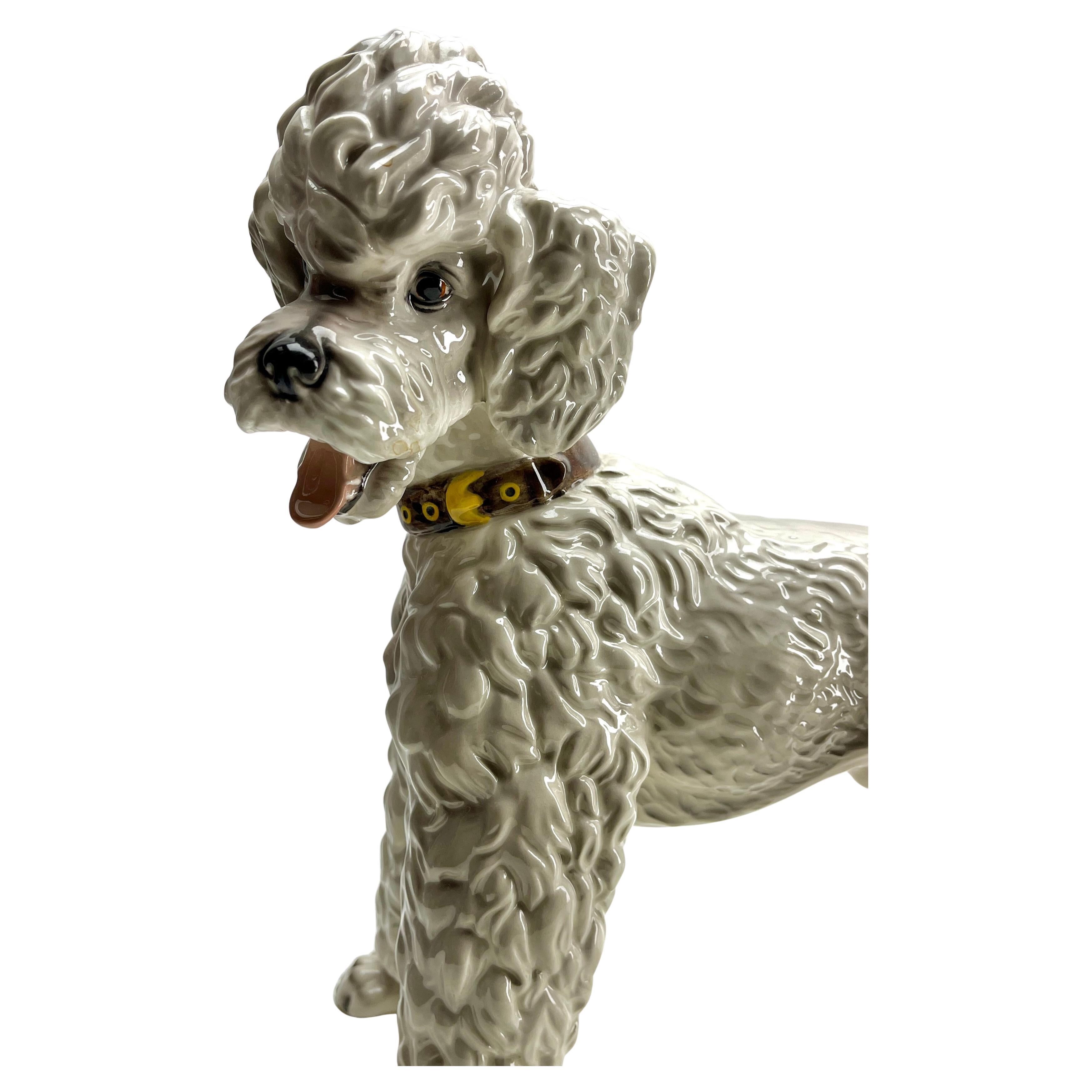 Antique Wien Keramos Austria Porcelain Poodle 1930's 
Charming Poodle Figurine
This stunning ceramic poodle exudes elegance and nostalgia, making it a perfect addition to any vintage or decorative interior style. With its detailed design and