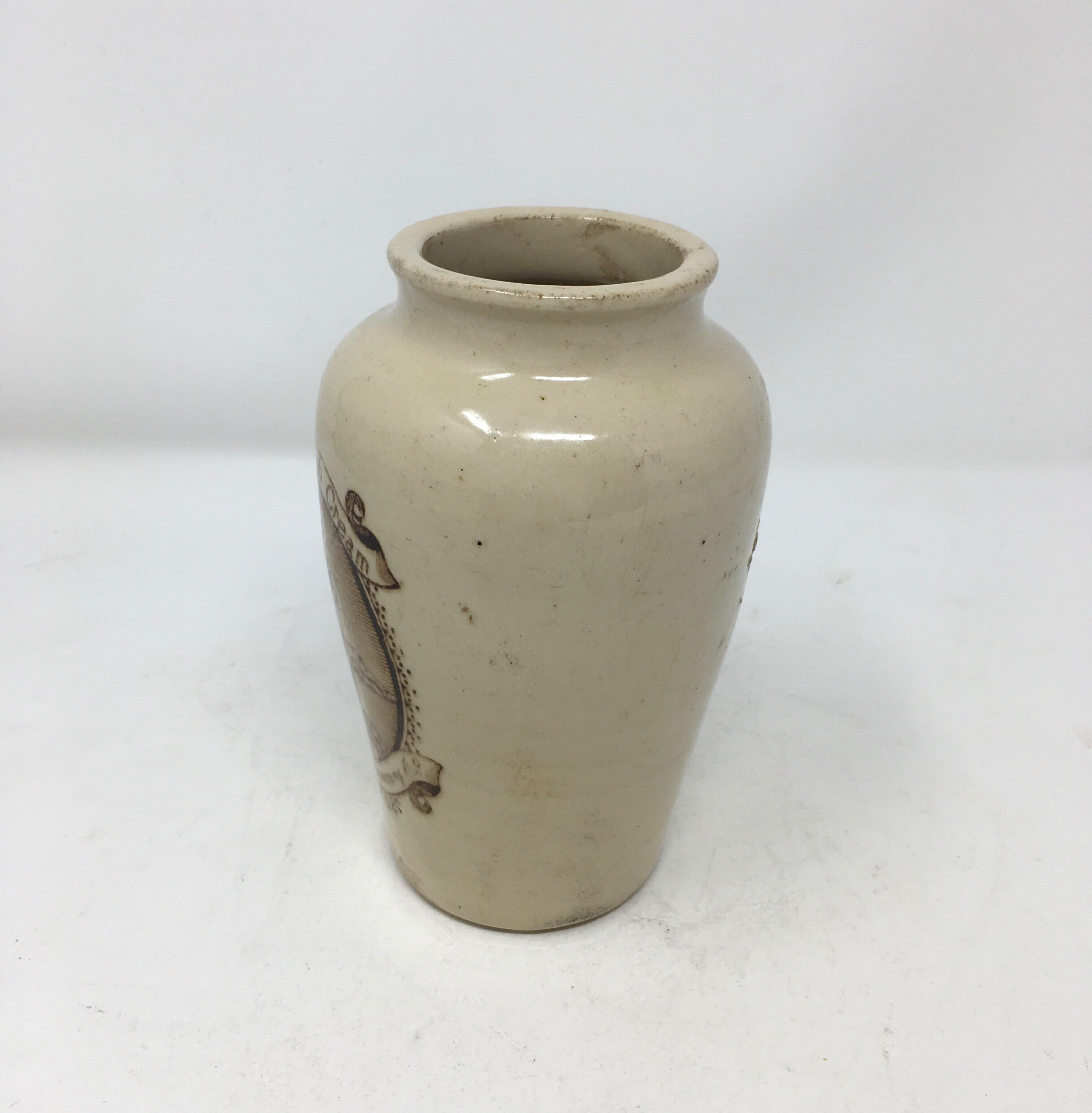 This is a fabulous stoneware transfer printed cream pot or crock, circa 1900. It once contained Pure Fresh Cream from the Wigtownshire Creamery Co. in Stranraer, Scotland. 
The sturdy stoneware advertising crock is stamped Port Dundas Pottery