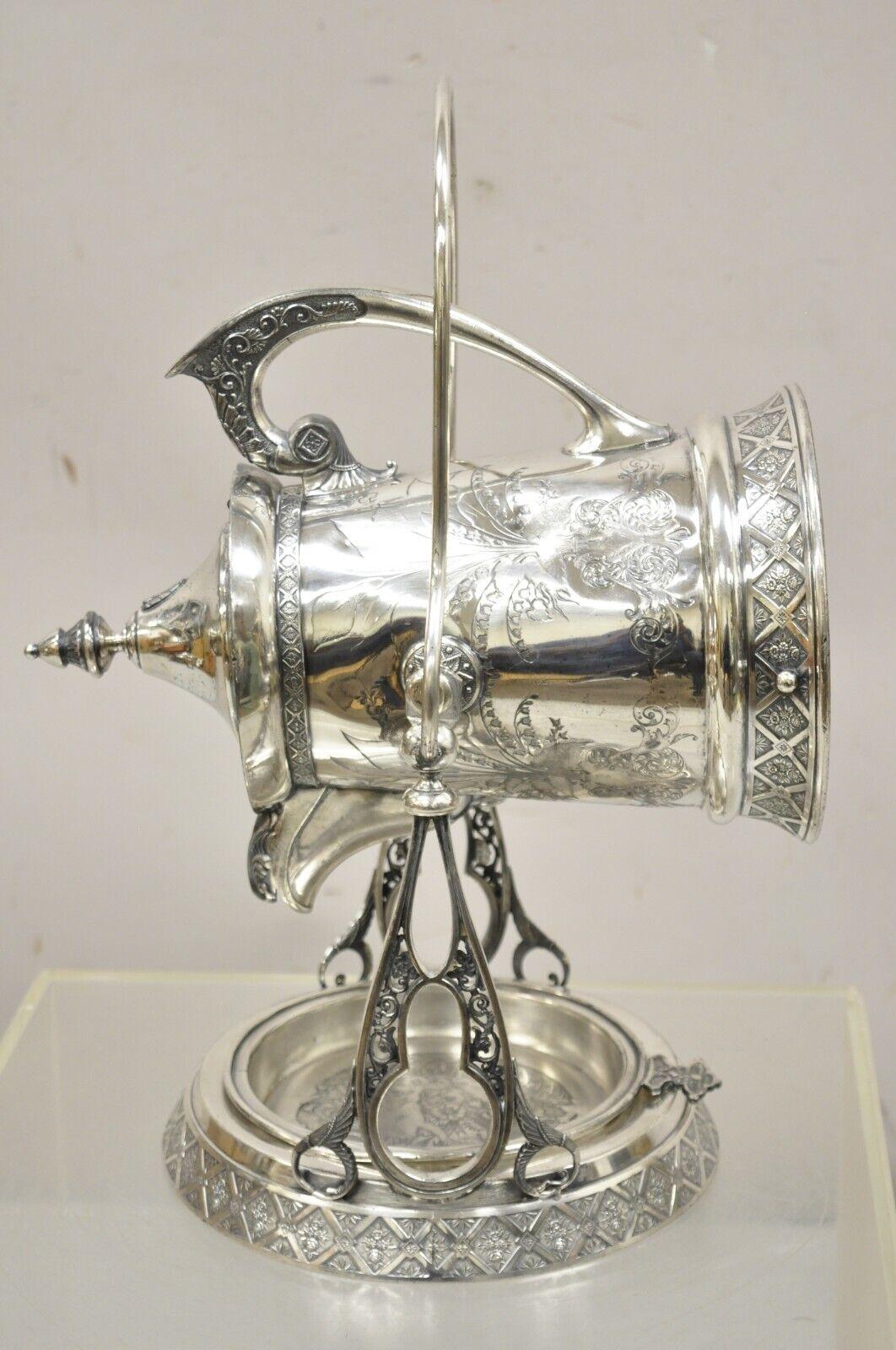 Antique Wilcox Silver Plate Co Victorian Porcelain Lined Tilting Coffee Tea Pot Dispenser. Item features ornate floral etched scrollwork, tilting beverage dispenser, porcelain lined interior, original hallmark, very nice antique item. Circa 1900.