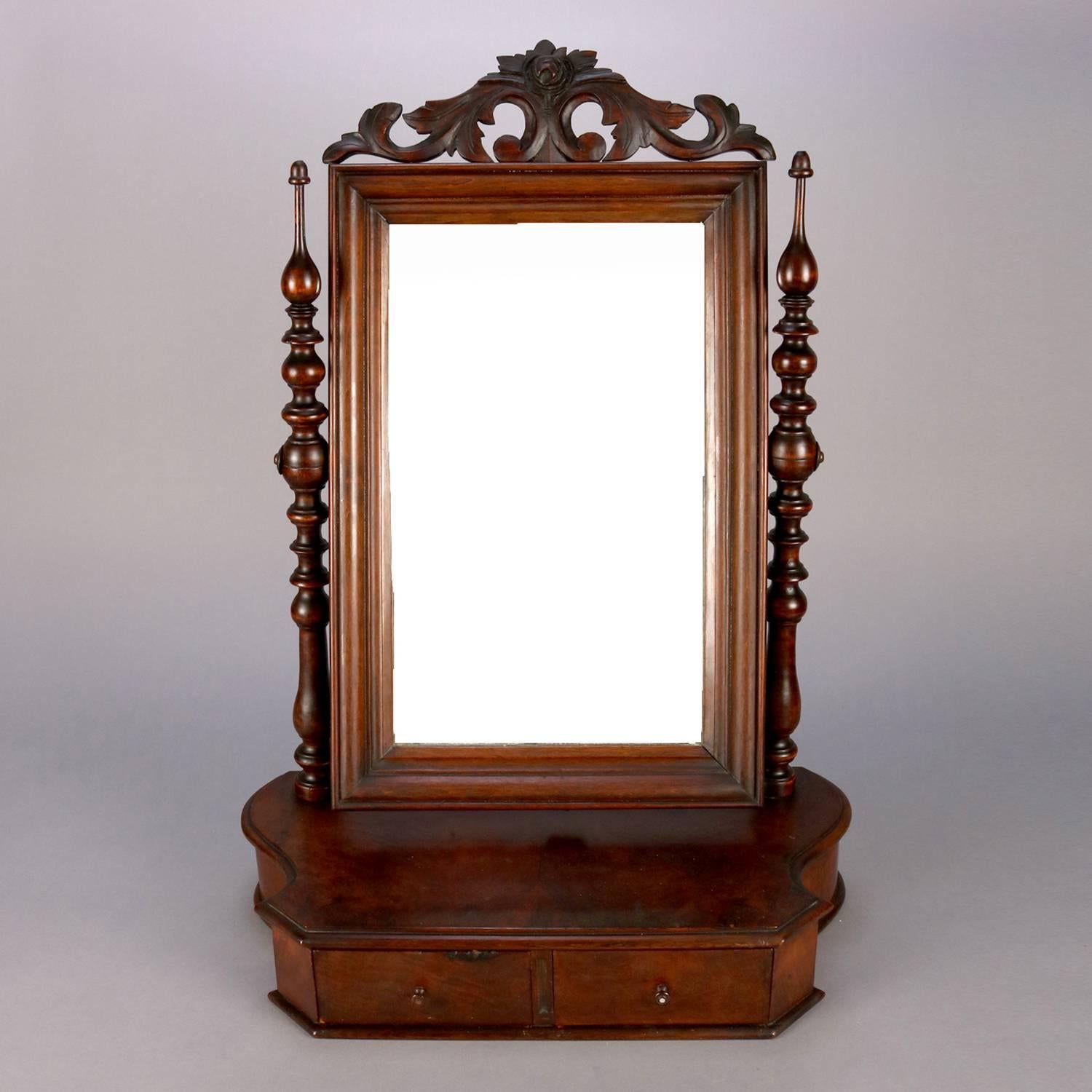 Antique William and Mary carved mahogany shaving mirror features mirror with carved foliate crest flanked by turned supports and seated on shaped case with two drawers, circa 1830

***DELIVERY NOTICE – Due to COVID-19 we are employing NO-CONTACT