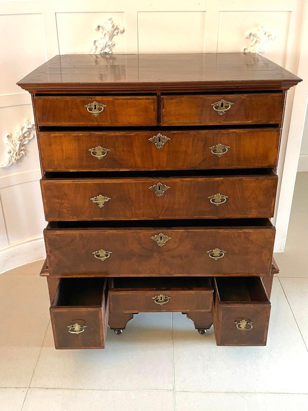 Antique William and Mary quality figured walnut chest on stand having a quality figured walnut polished rectangular shaped top above two short and three long herringbone inlaid figured walnut oak lined drawers, original engraved brass handles and