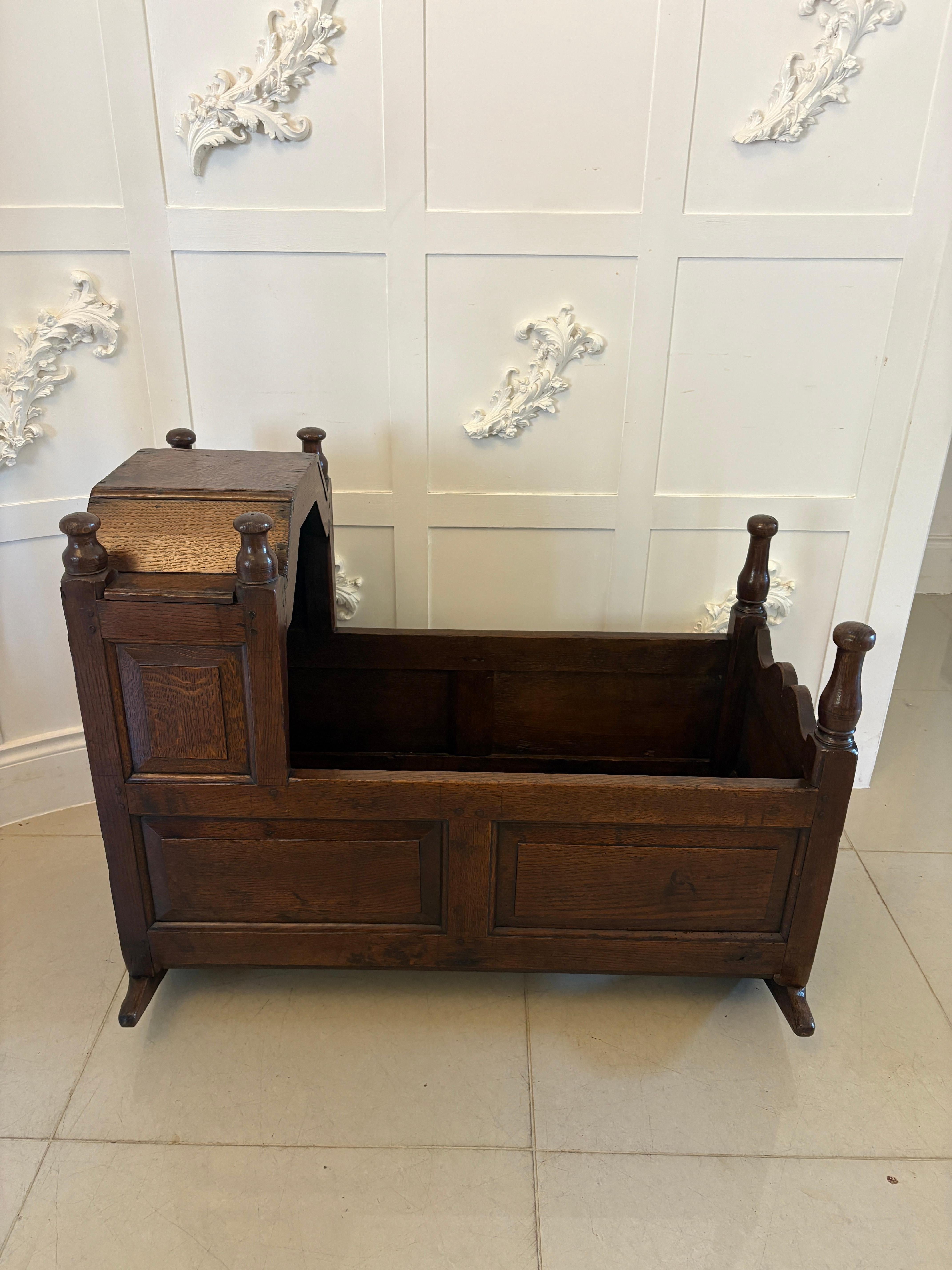 Antique William and Mary quality oak panelled rocking crib having a quality oak shaped hood, six turned finales, lovely oak panels standing on shaped oak rockers

A charming 17th century example in lovely original condition.

Dimensions:
Height 74