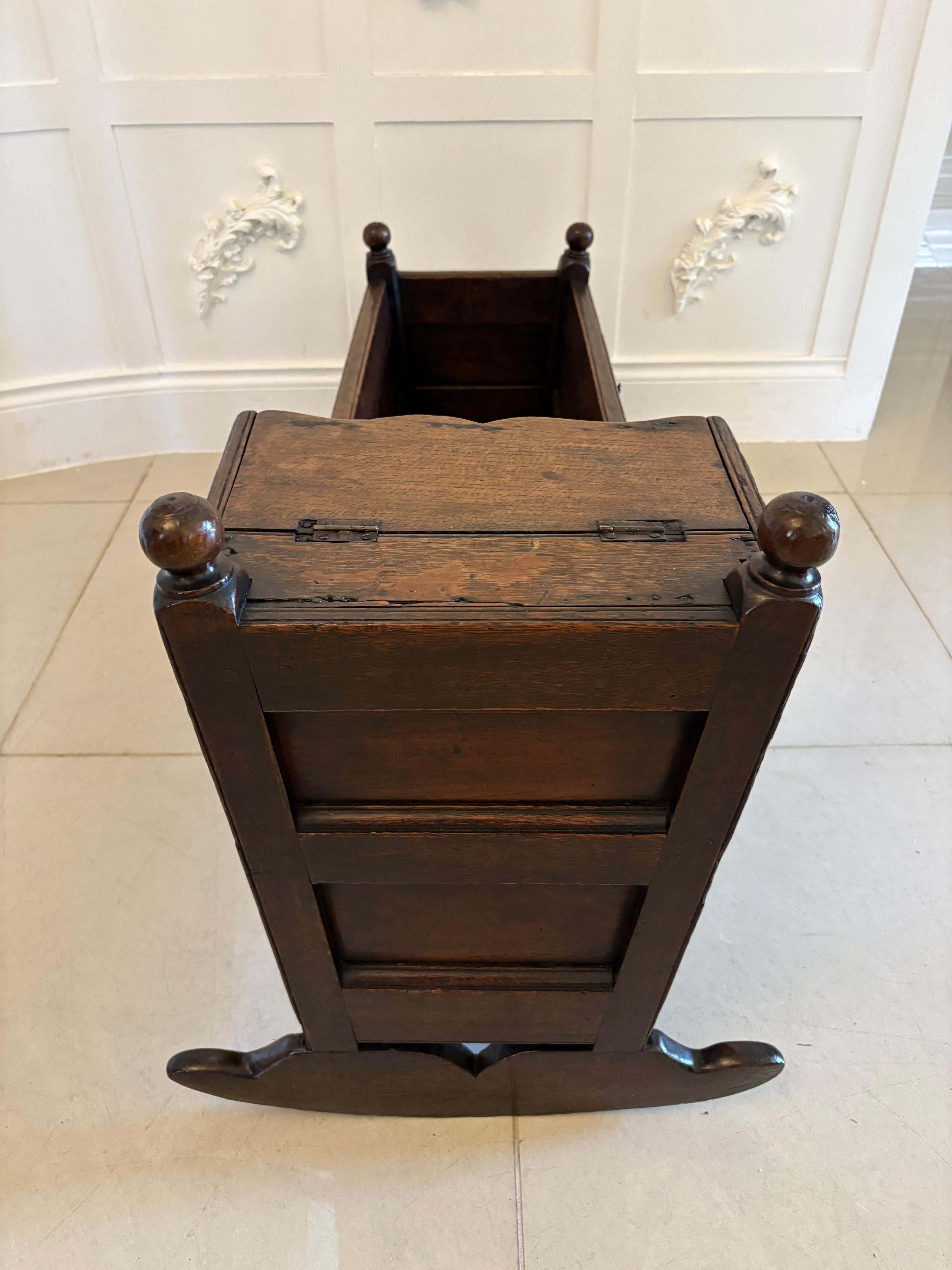 Antique William and Mary quality oak panelled rocking crib having a quality oak shaped hood with a lift up canopy, four turned finales, lovely oak panels standing on shaped oak rockers

A delightful 17th century example in lovely original