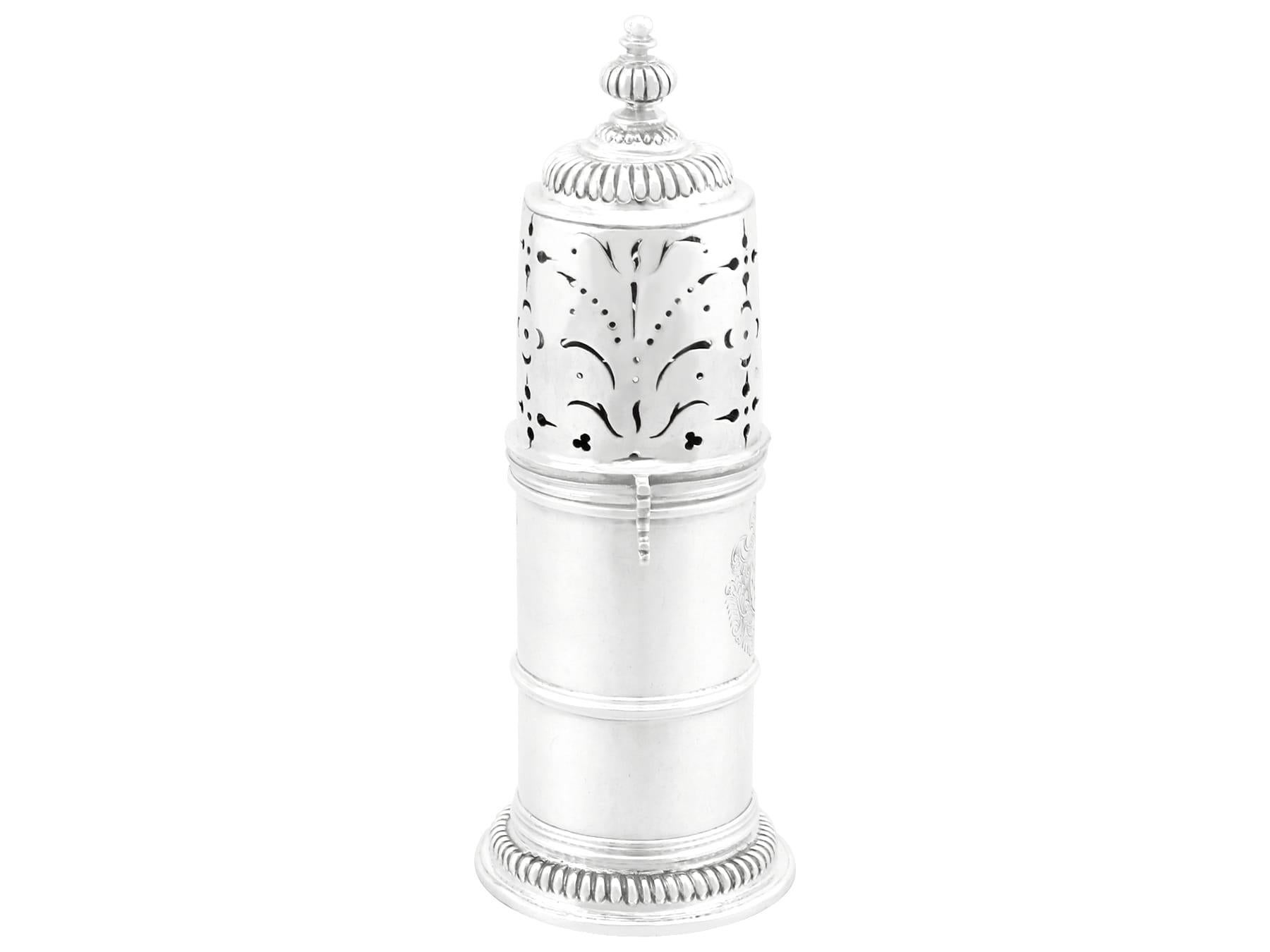 An exceptional, fine and impressive antique William III English Britannia standard silver lighthouse style caster; an addition to our silver teaware collection.

This exceptional antique William III English Britannia standard silver caster has a