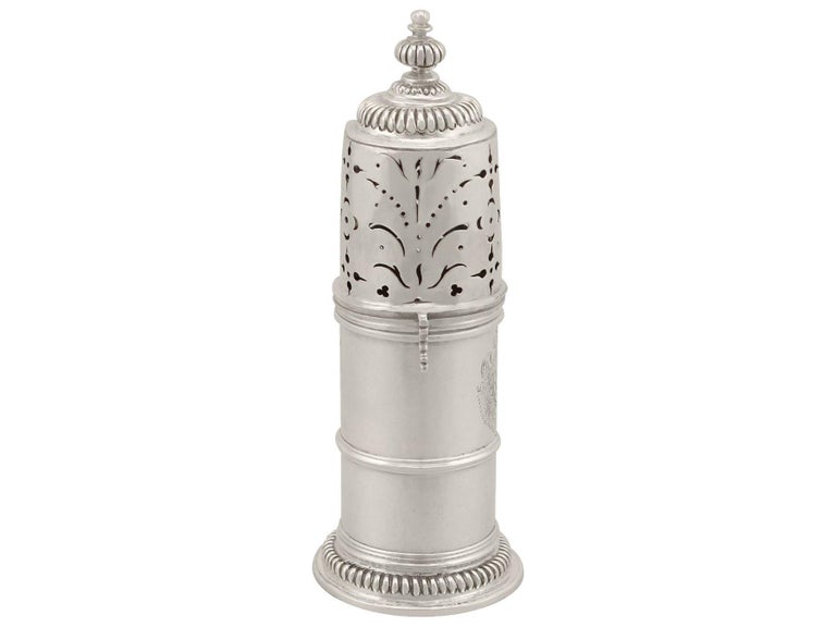 An exceptional, fine and impressive antique William III English Britannia standard silver lighthouse style caster; an addition to our silver teaware collection.

This exceptional antique William III English Britannia standard silver caster has a