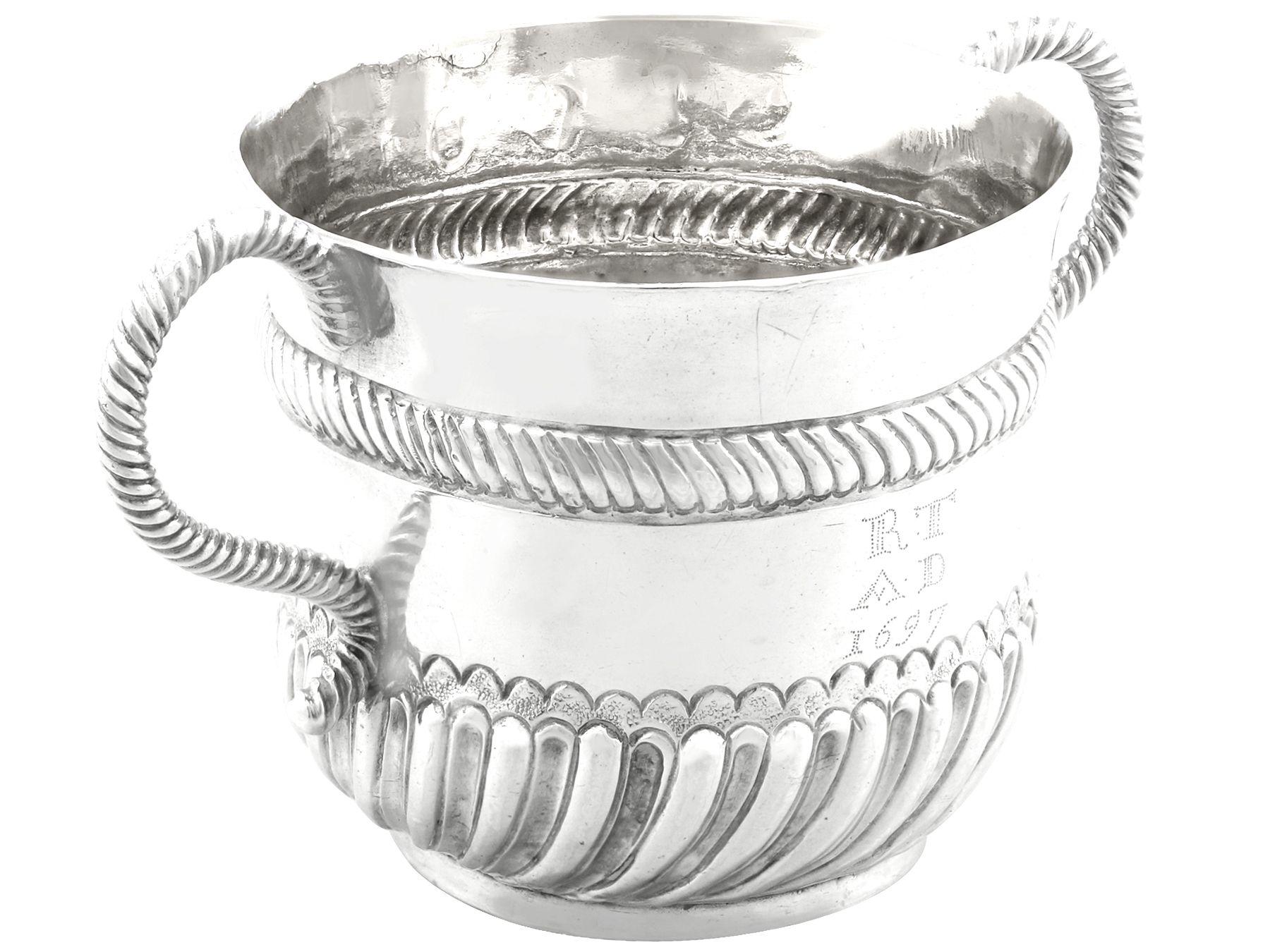 An exceptional, fine and impressive antique William III English Britannia silver porringer, an addition to our 18th century silverware collection.

This antique William III Britannia standard silver porringer has a circular rounded form.

The