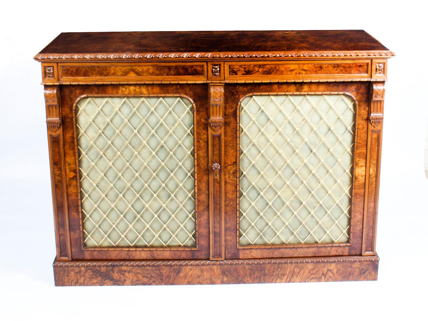 A superb quality antique William IV burr walnut chiffonier, circa 1830 in date.
 
This stupendous and rare burr walnut chiffonier has a rectangular top with a stunning hand carved beaded border. It has a useful pair of frieze drawers above a pair
