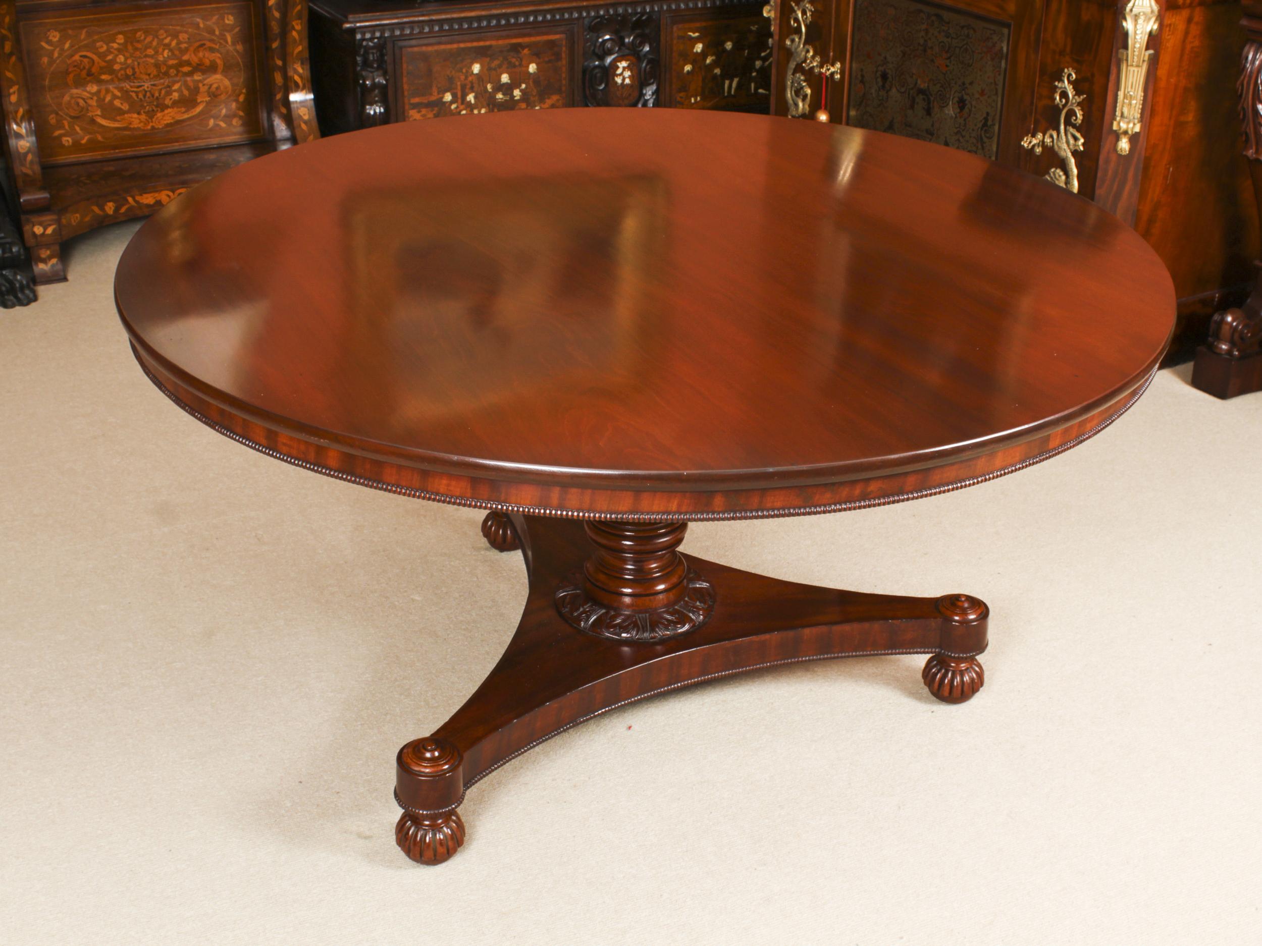 A fine antique William IV mahogany dining table, circa 1830 indate.

The circular snap top is made from beautiful mahogany, it features a beaded apron and is raised on a turned and reeded column with decorative carved acanthus at the base. The