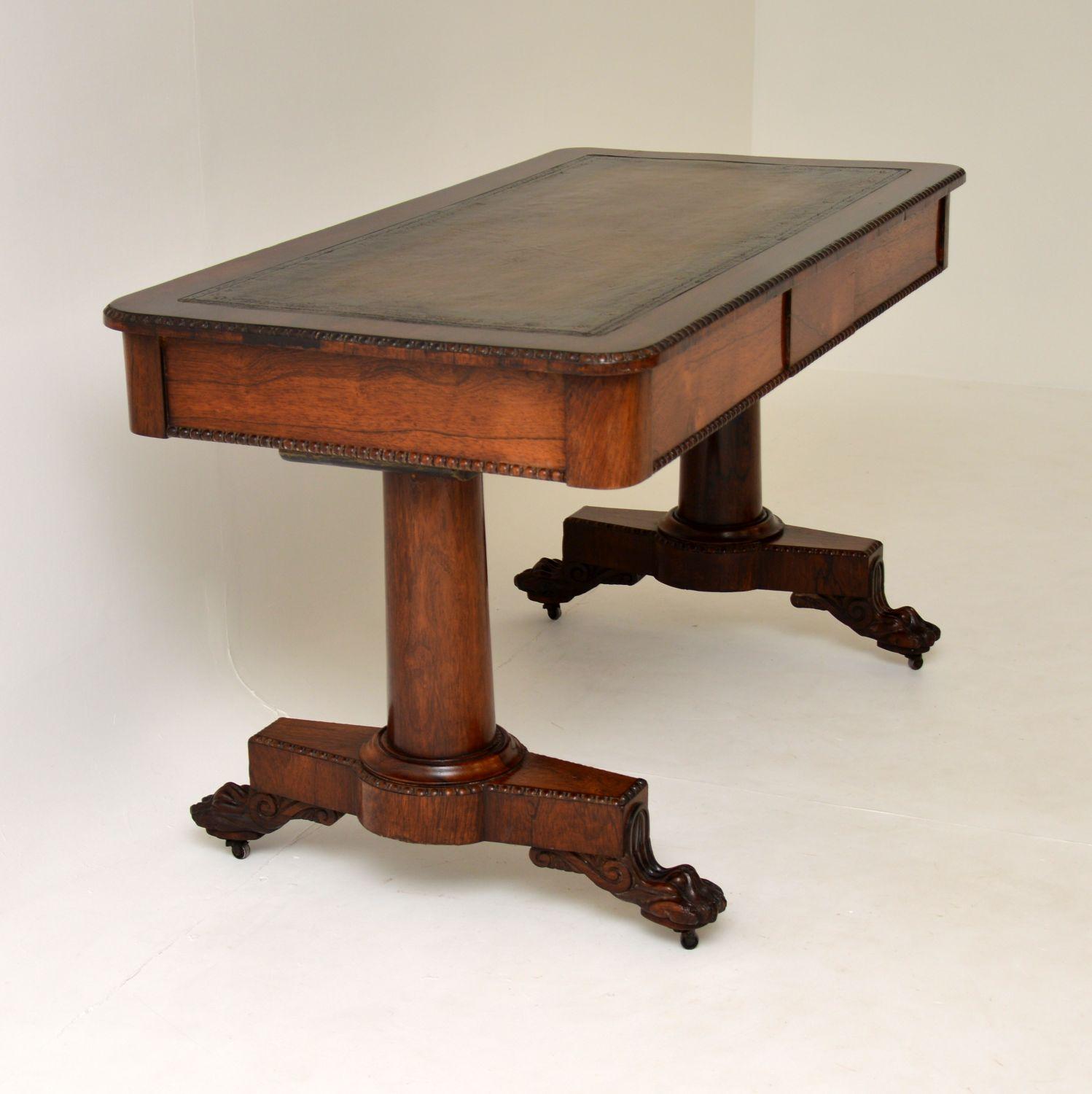 An absolutely stunning antique writing table in wood with an inset leather top. This is from the William IV period and dates from circa 1830-1840 period.

It is large and impressive, the quality is fantastic throughout. This sits on two thick