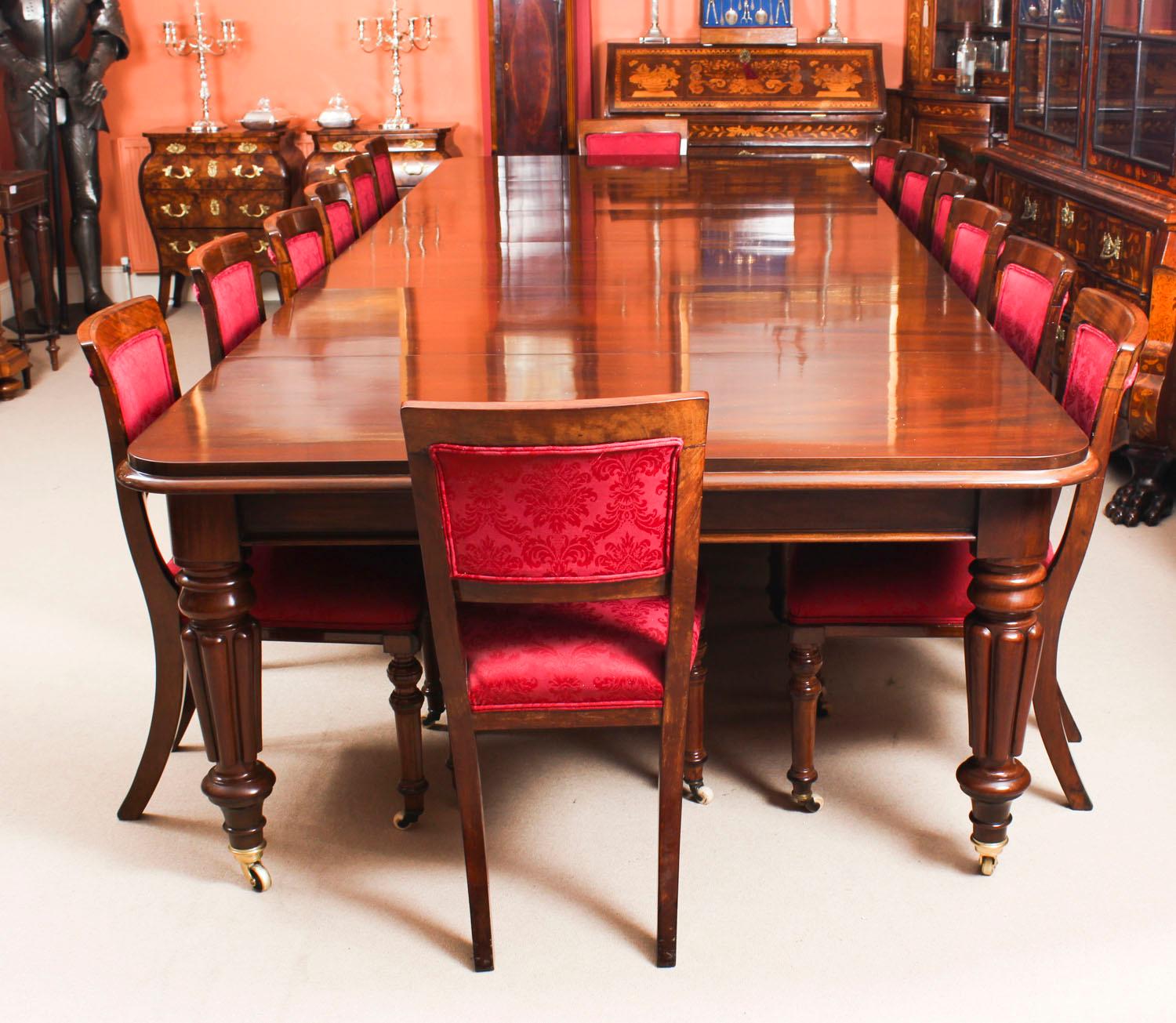 This is a magnificent antique dining set comprising a William IV solid mahogany dining table, circa 1830 in date and a set fourteen antique Victorian dining chairs, circa 1870 in date.

This beautiful table has a rounded rectangular top with a