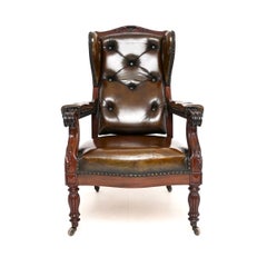 Antica poltrona con schienale ad ala di William Williams IV in pelle e noce