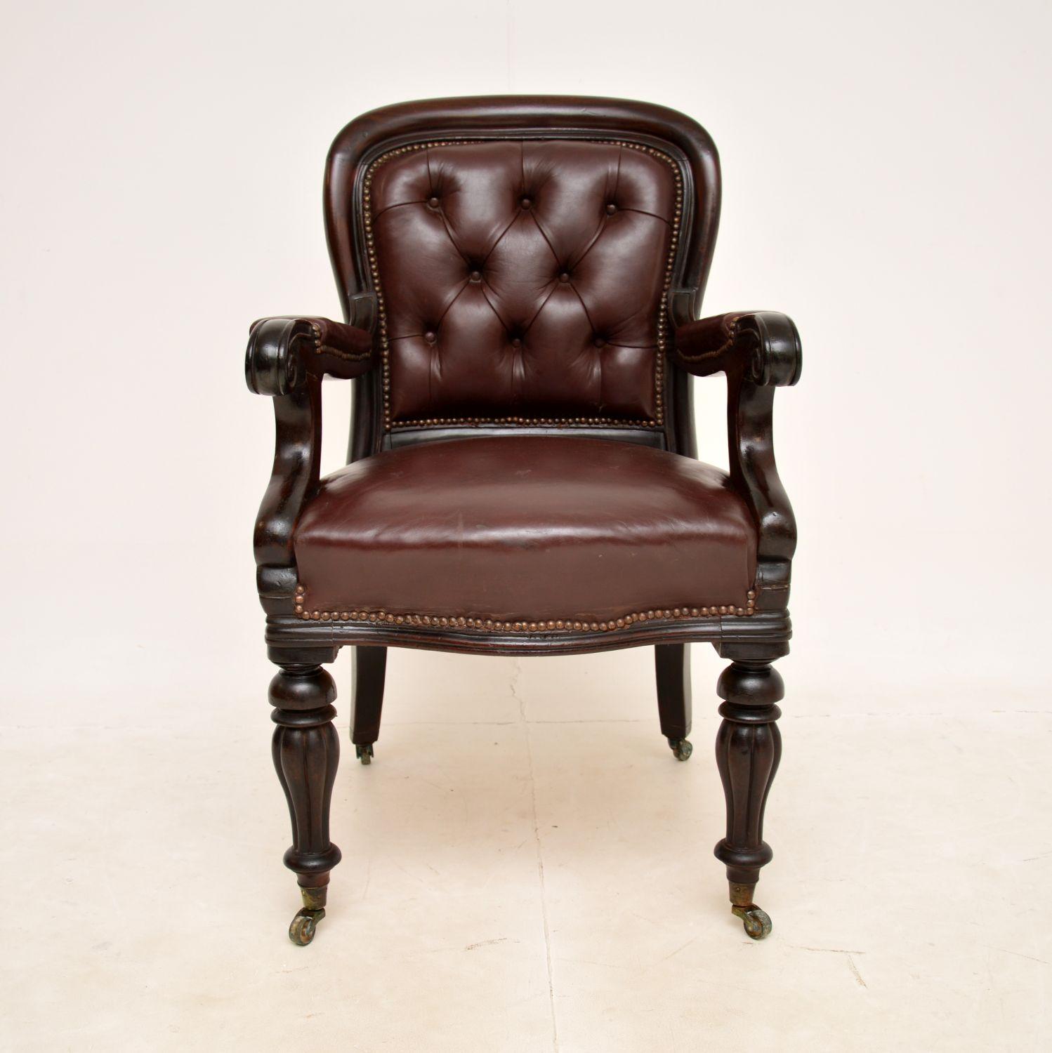 A superb antique William IV period armchair. This was made in England, it dates from around the 1830-40 period.

It is of superb quality, with a very sturdy and bold design. The fluted baluster legs are beautifully turned, this has a deep buttoned