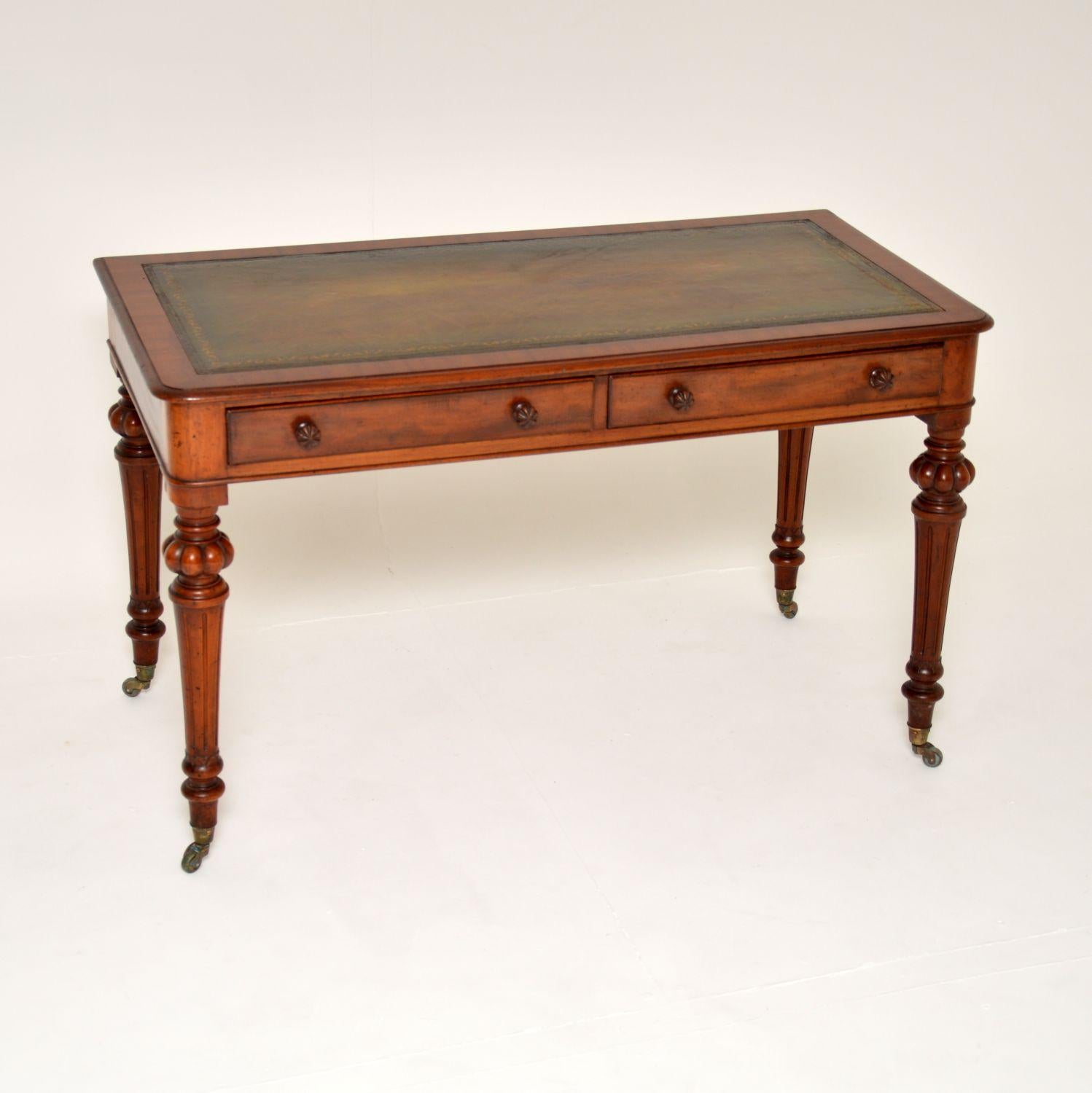 A superb antique William IV period writing table. This was made in England, it dates from around the 1830-40’s period.

It is of amazing quality, with fantastic bold carving around the legs. The handles are also carved in the typical William IV