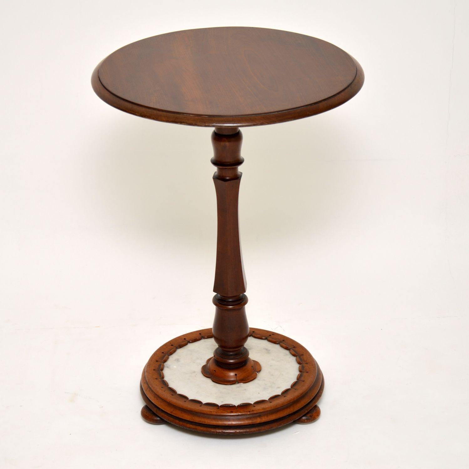 Very unusual antique William IV mahogany side table in excellent original condition and dating from the 1830s-1840s period.

It has a circular top with a turned pedestal, which has an octagonal middle section. The most interesting feature is the