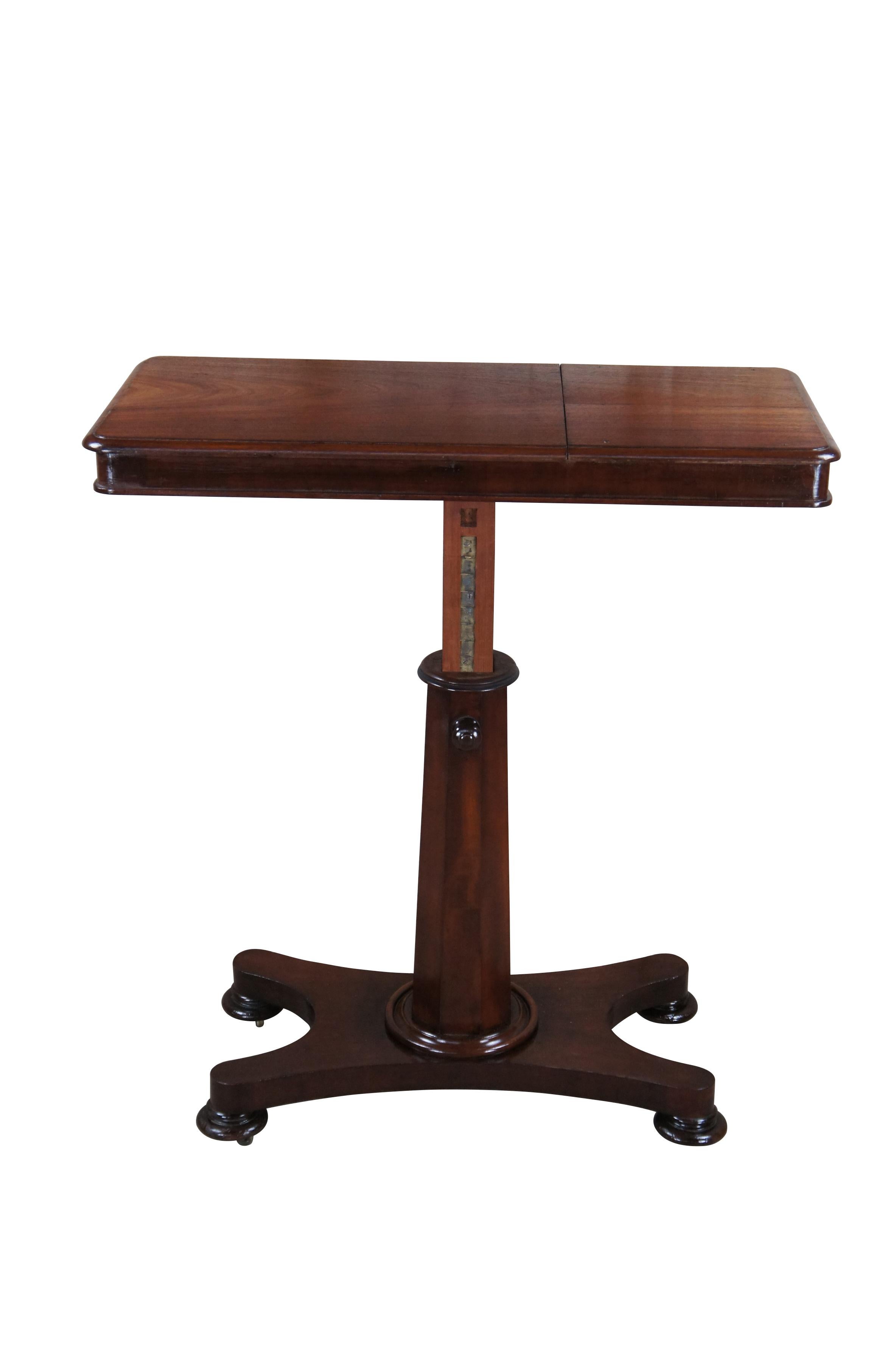 An impressive William IV era mahogany Invalids table.  Features a rectangular sliding top with a pair of ratcheted reading slopes to one side, over an adjustable octagonal stem above a shaped quadripartite base over flared bun feet with metal