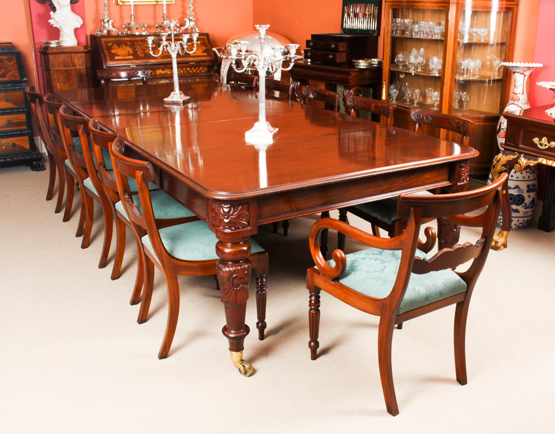 This is a fantastic dining set comprising of an antique William IV solid mahogany telescopic extending dining table, C1835 in date, with a set of twelve Vintage Regency Revival barback dining chairs.

The beautiful dining table is in stunning