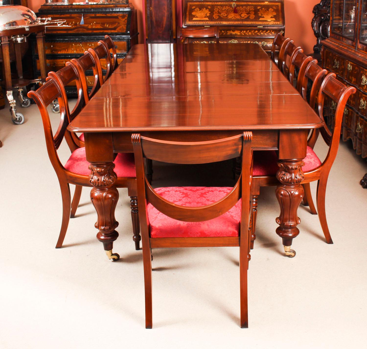 This is a fabulous dining set comprising of an antique William IV solid mahogany pullout dining table, circa 1835 in date, with a set of twelve vintage swag back dining chairs.

This beautiful table is in stunning flame mahogany, the pull out