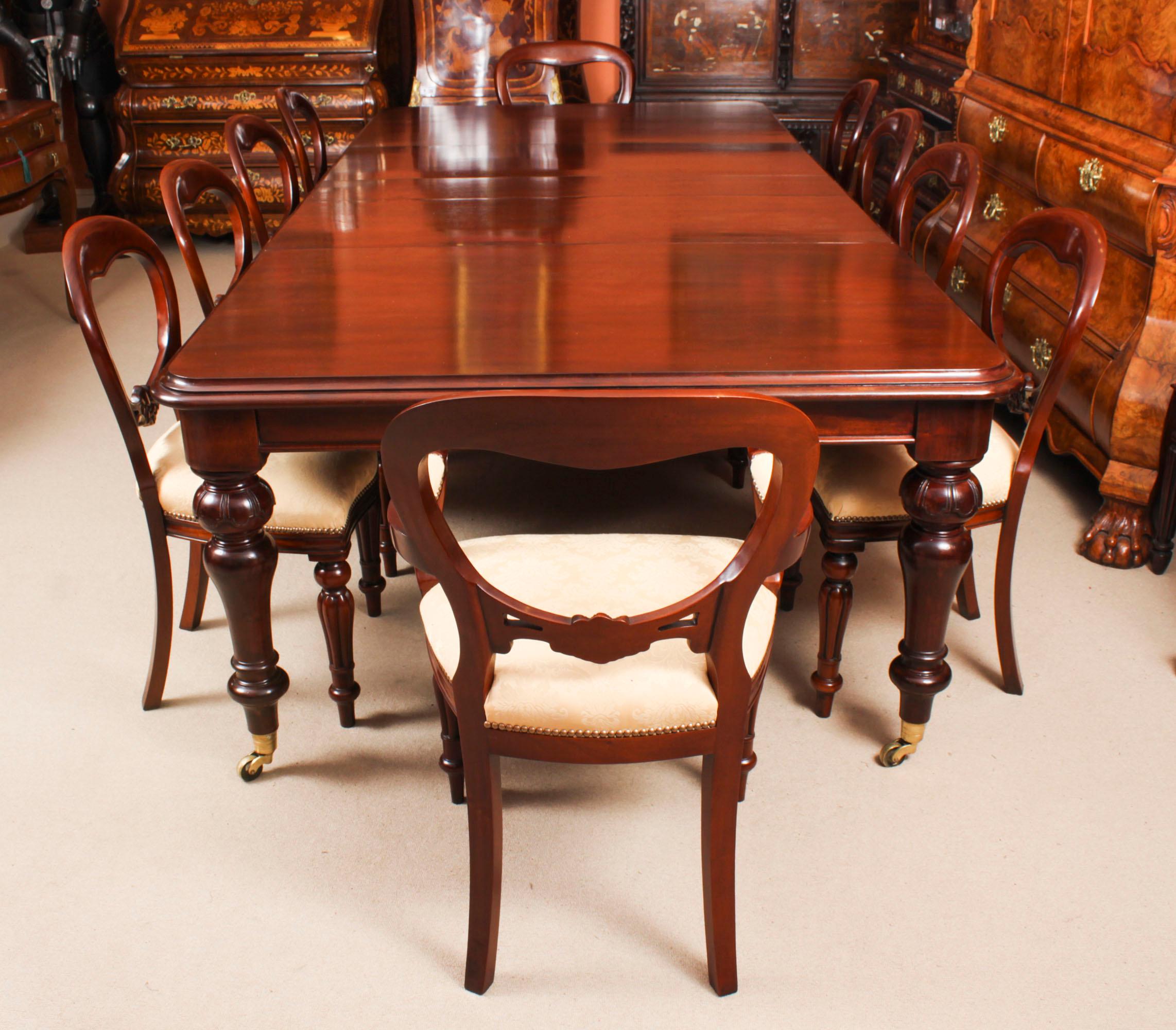 This is a fantastic  dining set comprising of an antique William IV dining table, C1835 in date,  with a set of ten balloon back  dining chairs, dating from the last quarter of the 20th century. 

The magnificent antique William IV solid mahogany