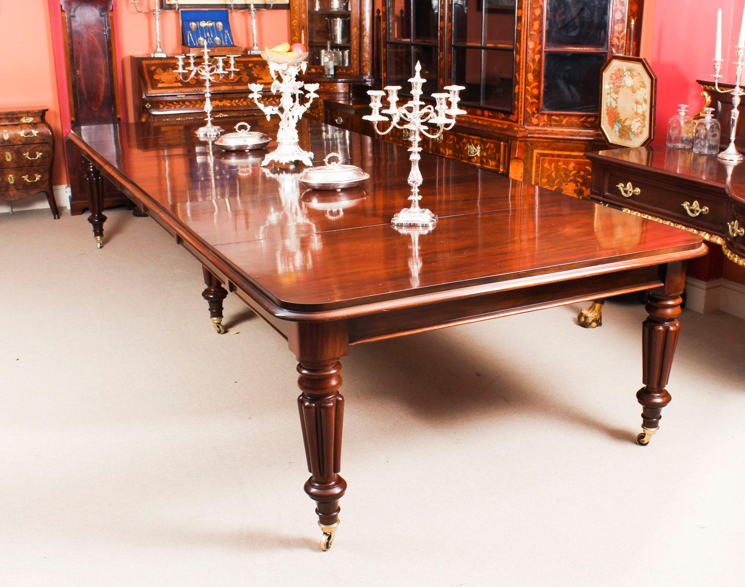 This is a magnificent antique William IV solid mahogany dining table, circa 1830 in date, which can seat fourteen and is also ideal for use as a conference table.

This beautiful table has a rounded rectangular top with a molded edge. The top is