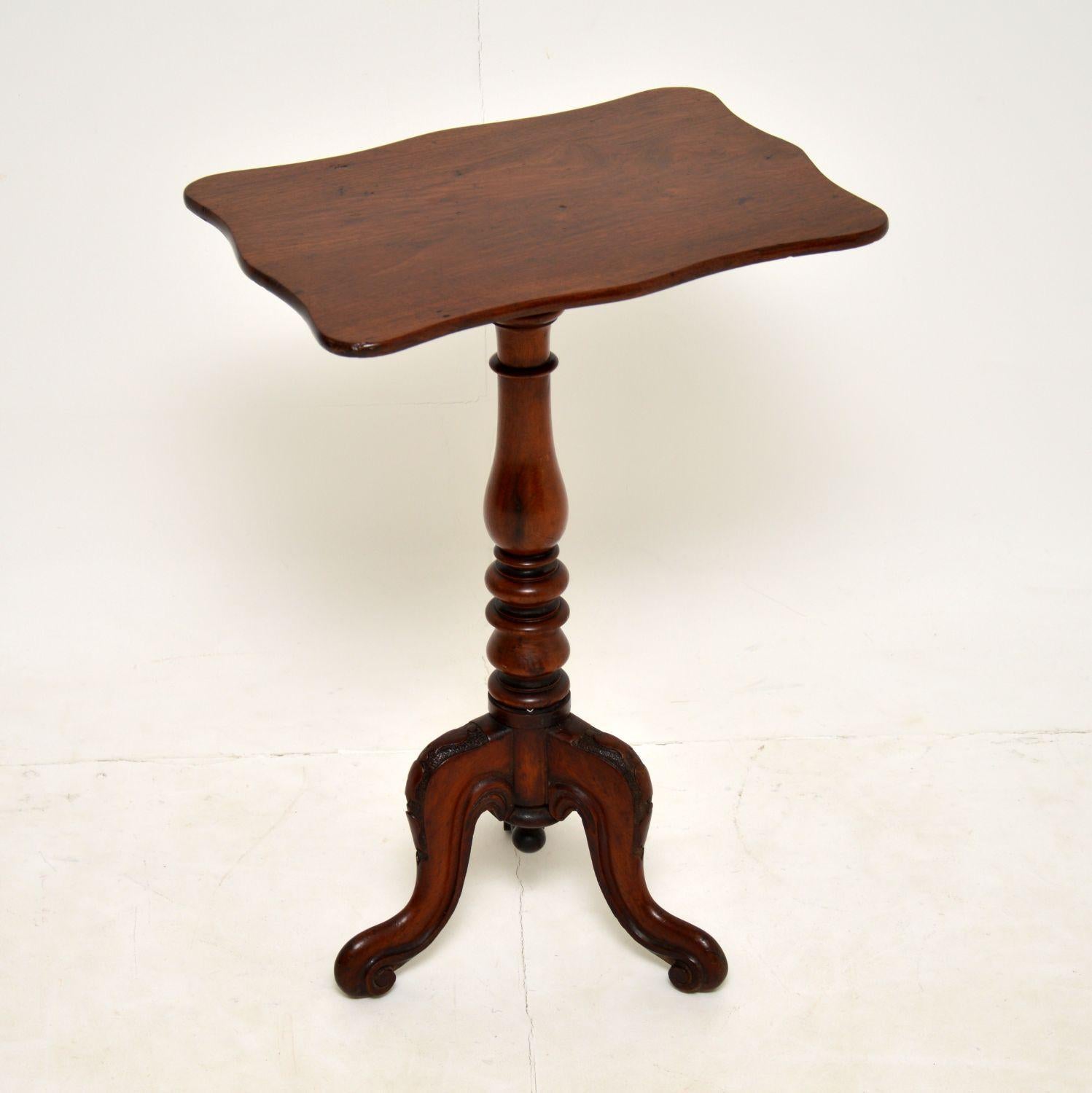 A lovely and very rare model, this antique mahogany side table is from the early Victorian period & was made in England, around the 1840-50’s period.

This is beautifully made from solid mahogany. It has a wonderfully carved tripod base, and an