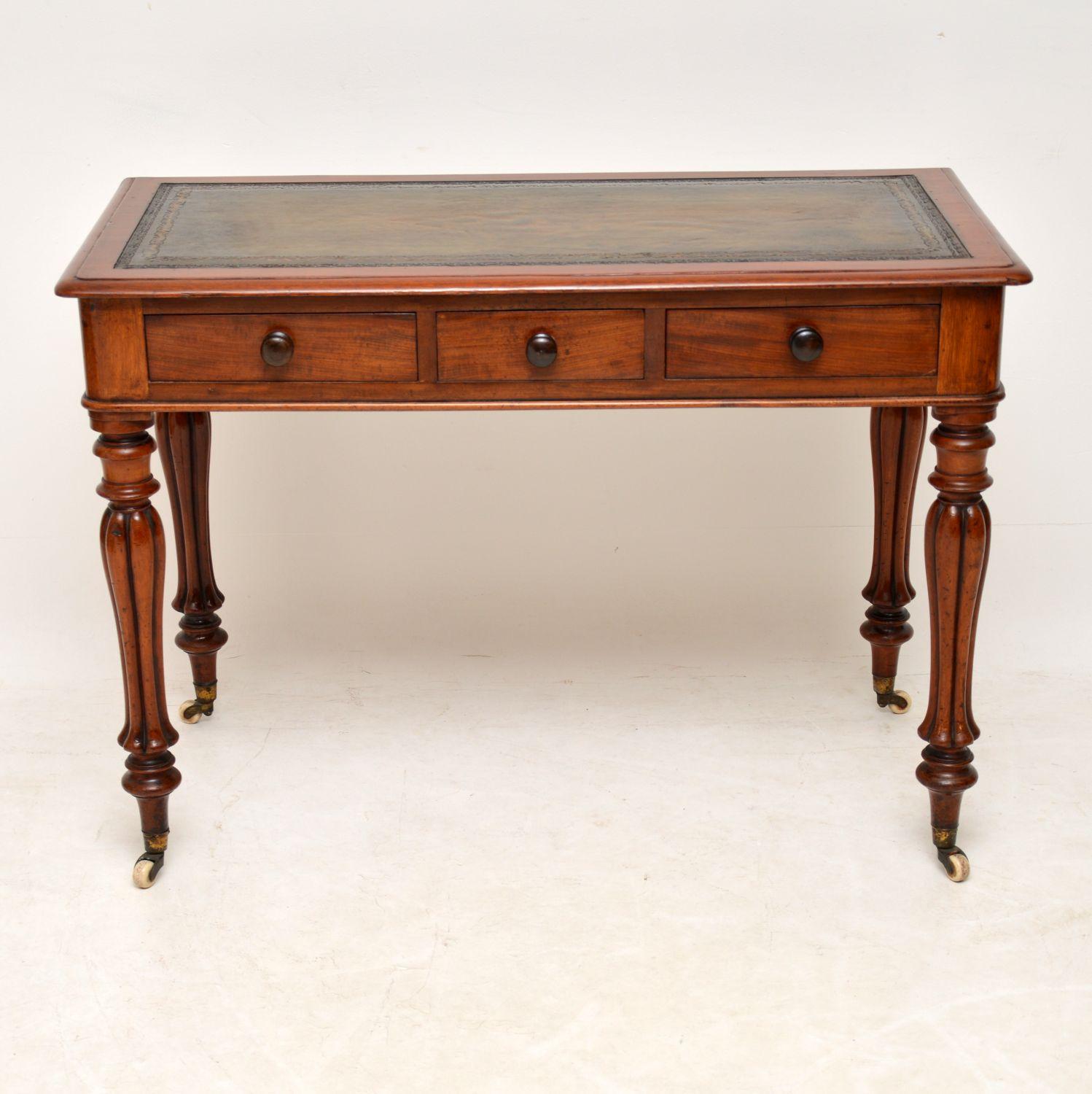 This antique William IV writing table is in wonderful original condition and is of very high quality. It has a polished back, three drawers on the front with turned bun handles and fine dovetails. The top has a hand colored tooled leather writing
