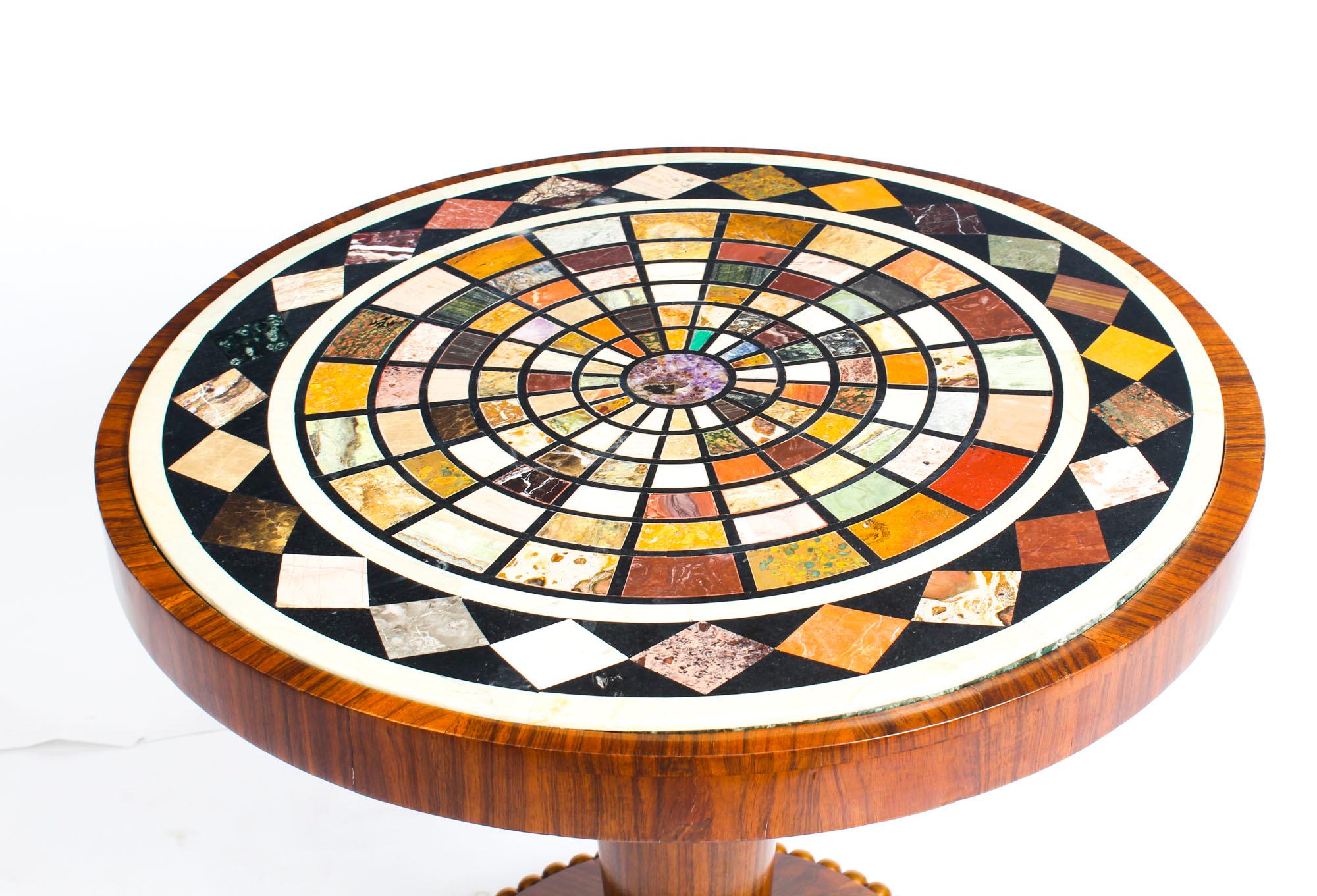 This is a superb antique William IV Gonçalo alves occasional table, circa 1830 in date, with a later inset pietra dura circular marble top, inlaid with radiating bands of specimen stones.

The Gonçalo alves ebonized & gilt centre table is inset