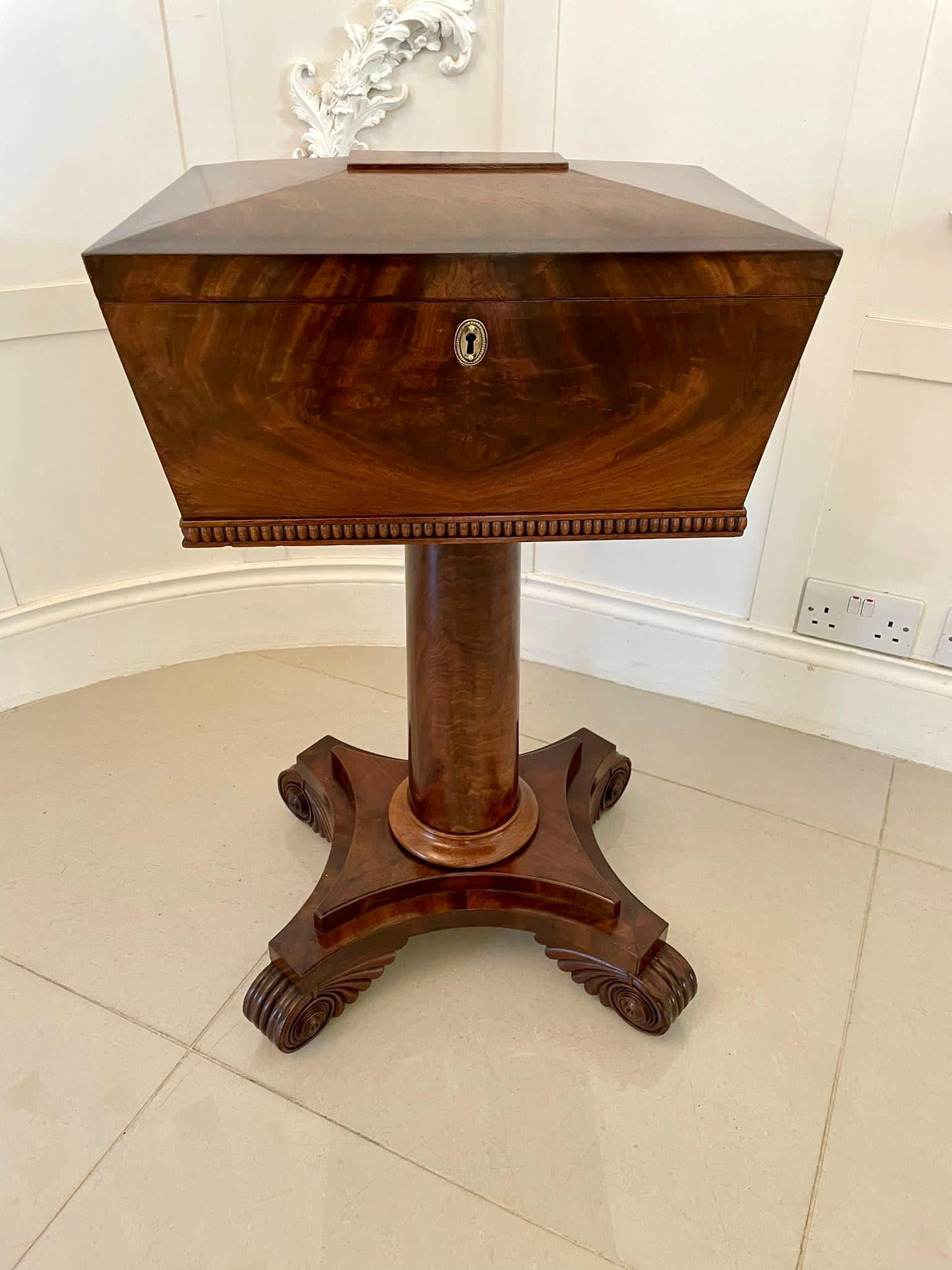 Antique William IV quality figured mahogany work box having a quality figured mahogany work box with a lift up lid opening to reveal a fitted interior consisting of five original lidded storage compartments. It is supported by a figured mahogany