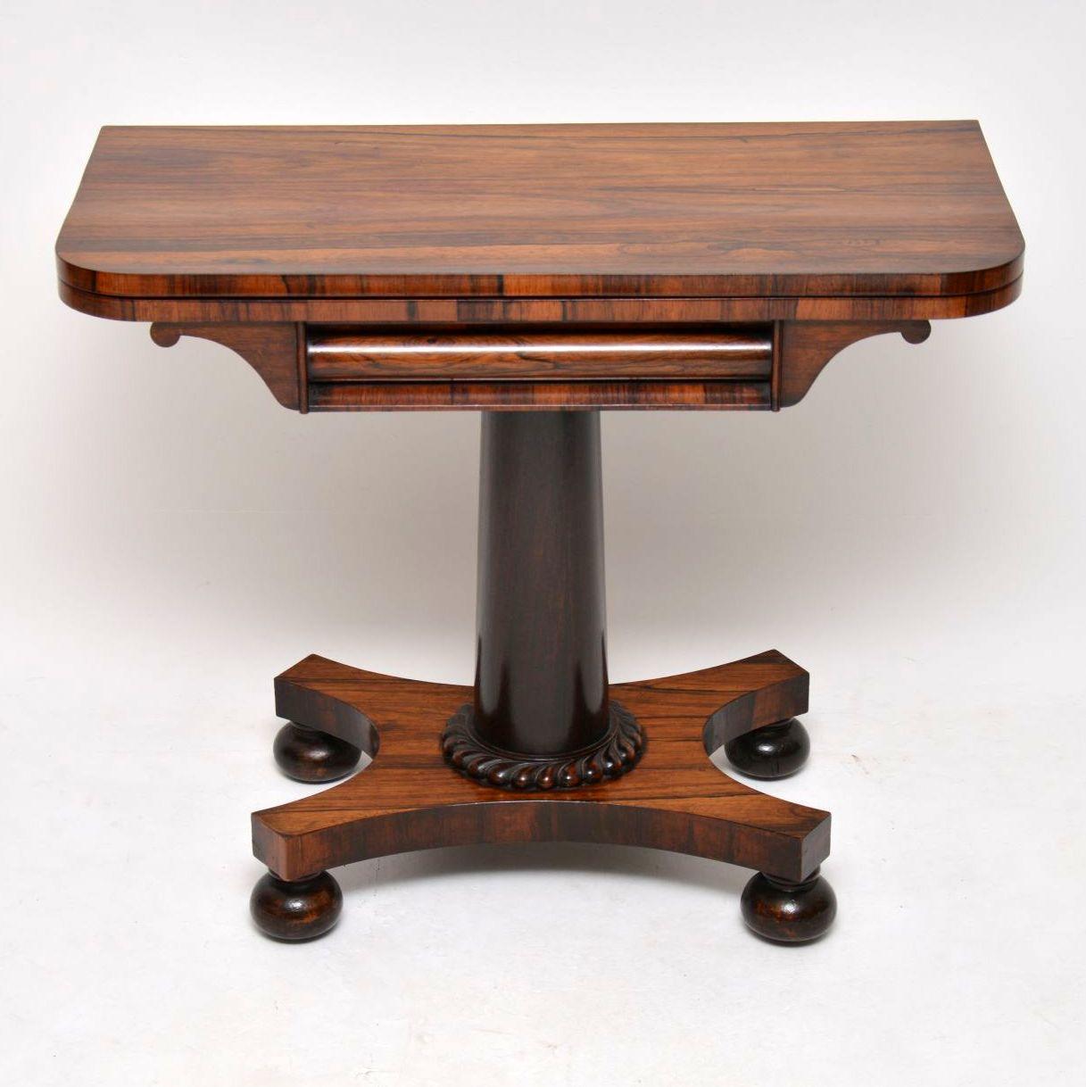 Antique William IV rosewood card table in good condition dating to circa 1830s-1840s period. The rosewood is nicely patterned all-over and it’s even polished on the back. The table top swivels around and opens up to rest on frame below which also