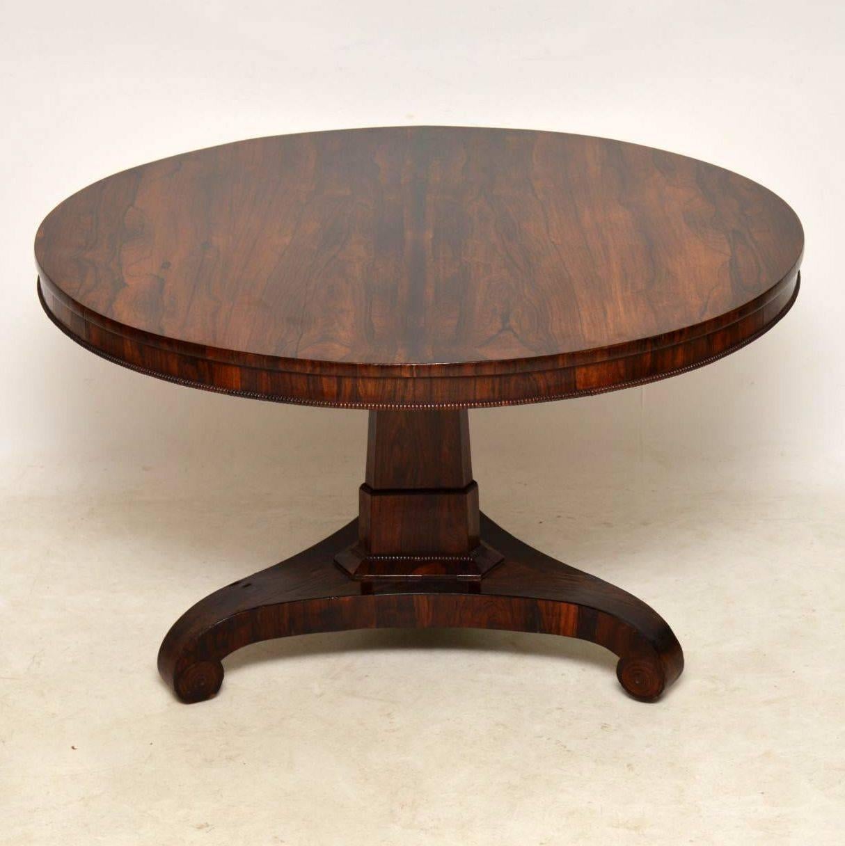 Antique rosewood circular dining or centre table in very good condition and dating from the William IV 1830-40 period. The top can be taken off or flipped up on the base. The rosewood grain, especially on the top is very well patterned. The top has