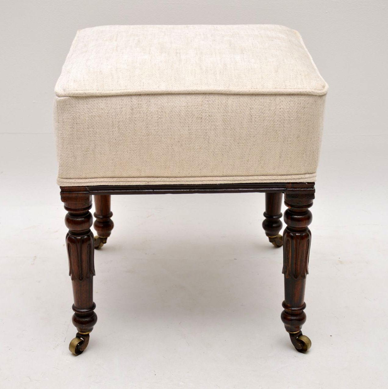Antique William IV rosewood stool in excellent condition, dating from the 1830-37 period and having just been French polished and re-upholstered. This stool has the typical William IV tulip shaped legs in solid rosewood with original brass