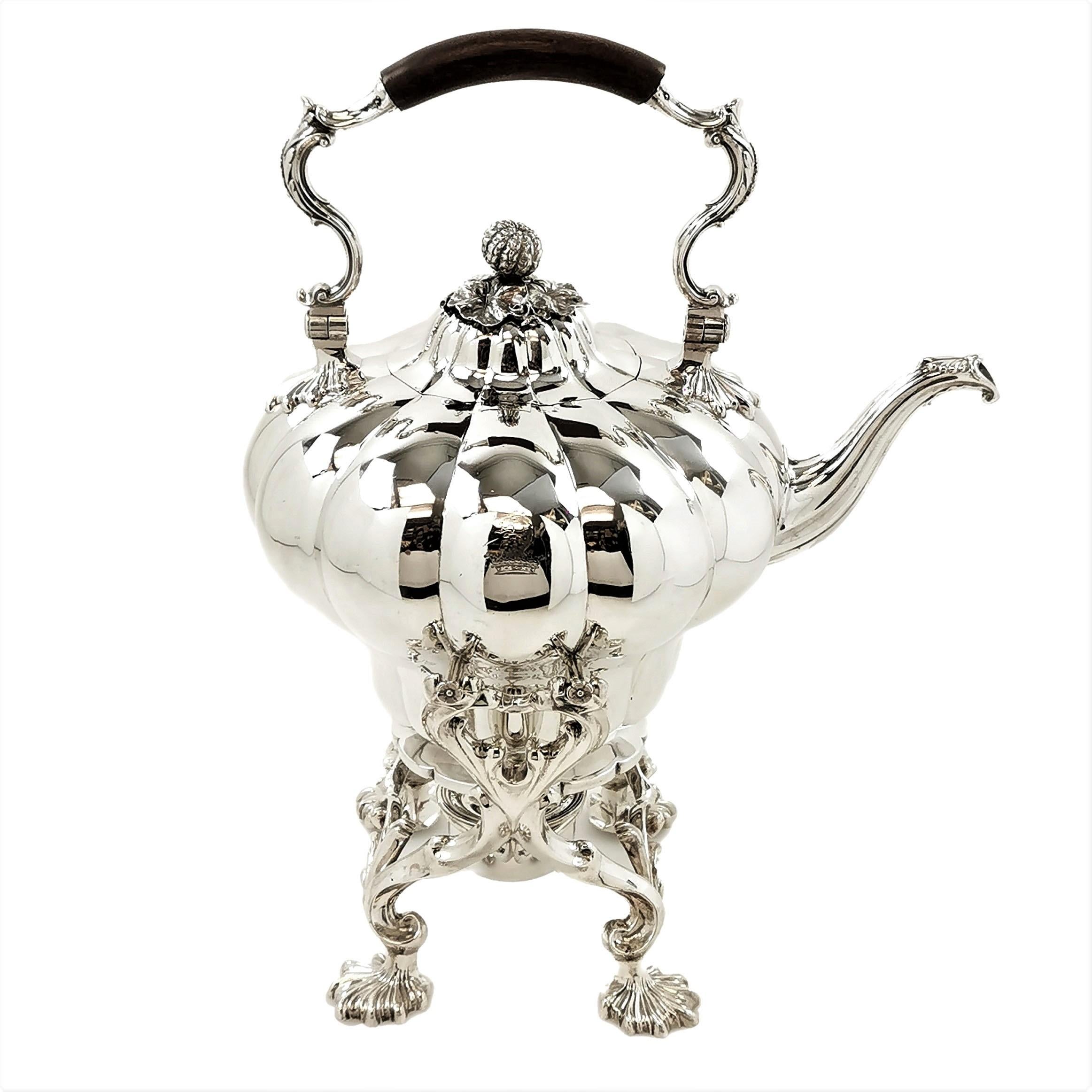 An impressive antique William IV solid Silver Kettle on Stand in an elegant classic Melon pattern. The stand rests on 4 shell feet and has a removable burner resting in the centre. The Kettle has a small crest engraved on the size. This Kettle on