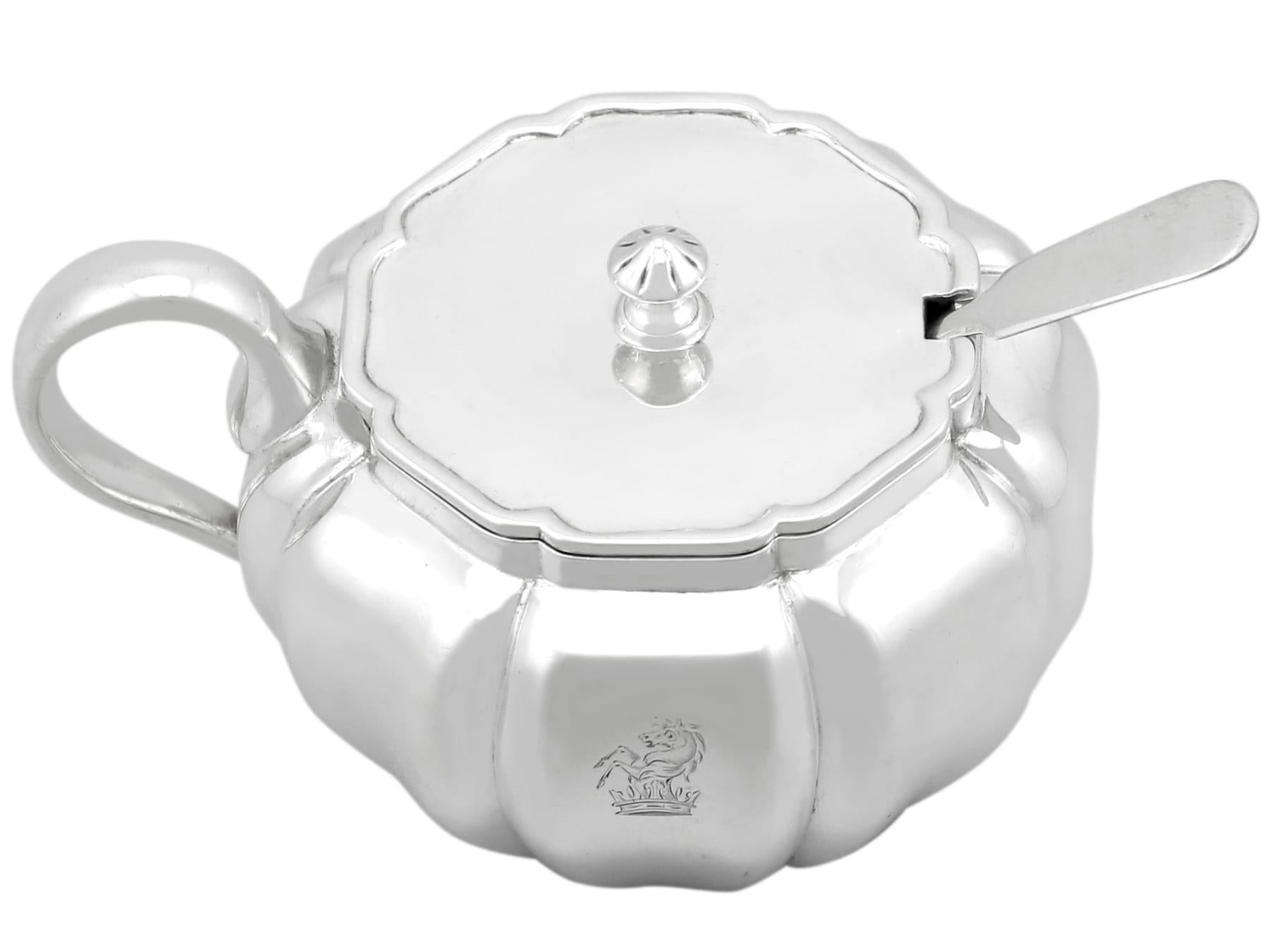 An exceptional, fine and impressive antique William IV English sterling silver mustard pot with blue glass liner and spoon; an addition to our antique 19th century silverware collection.

This exceptional antique William IV sterling silver mustard
